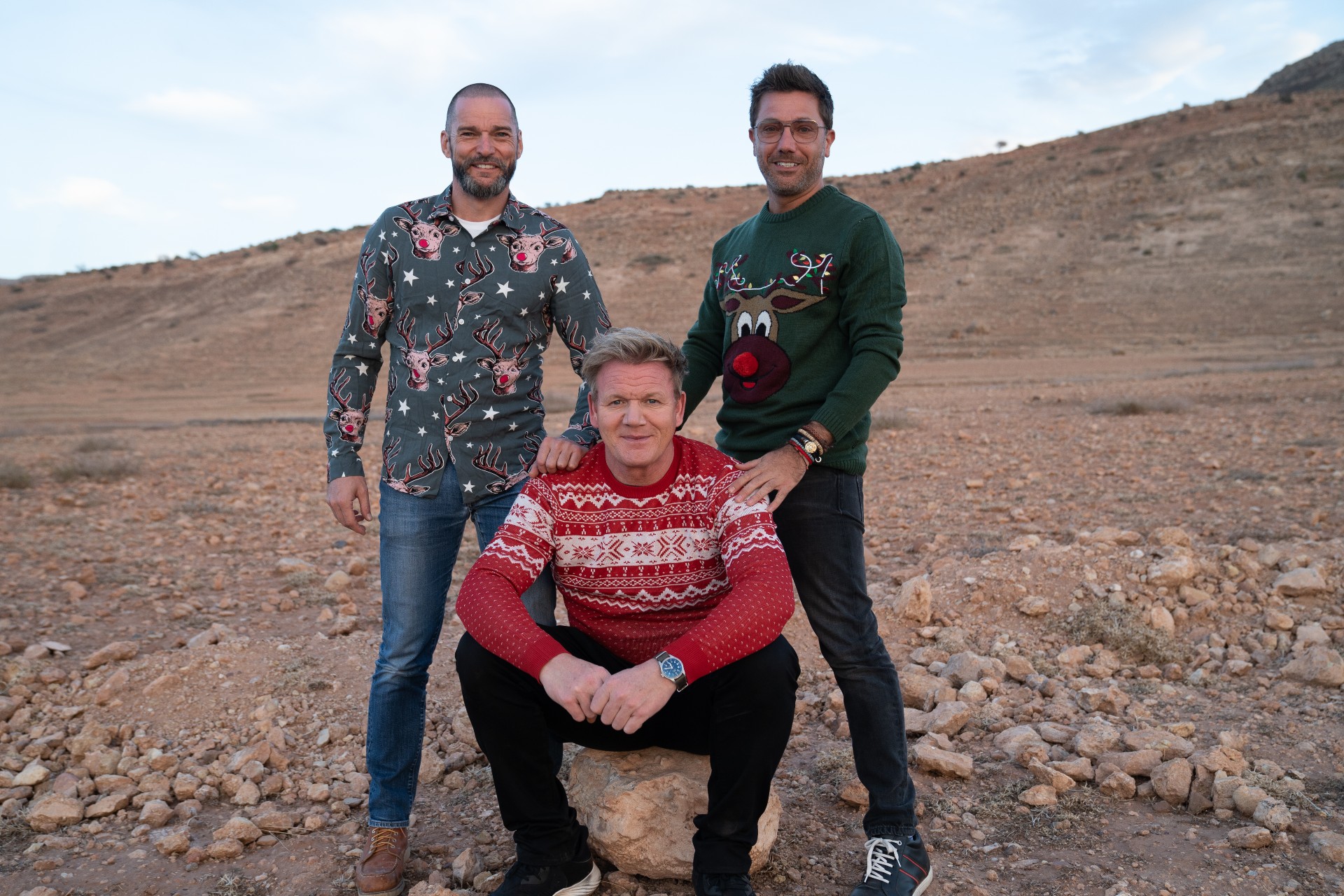 Gordon, Gino and Fred posing in the middle of a desert 