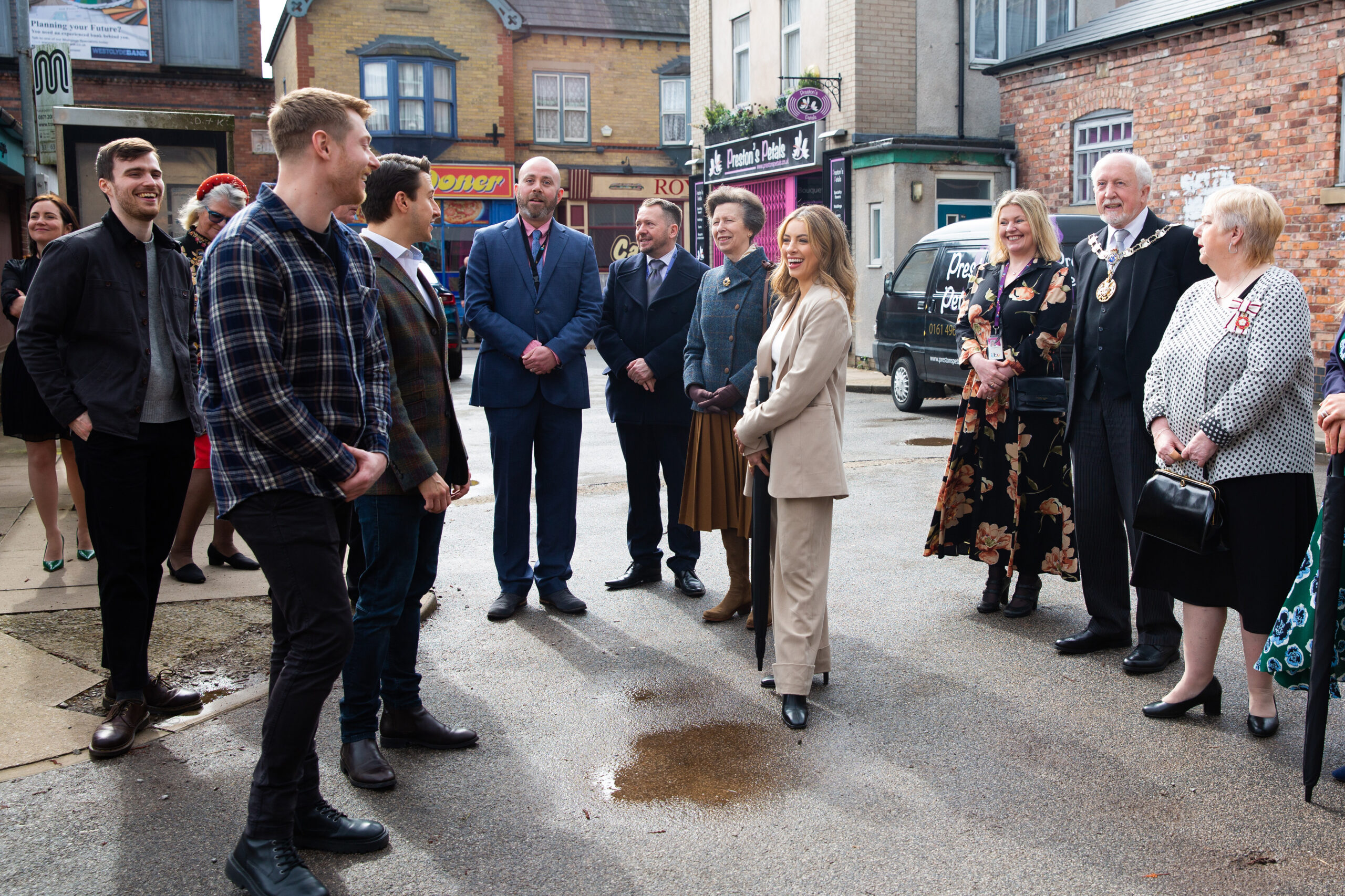 Princess Anne on the Coronation Street set with the cast and crew of the soap