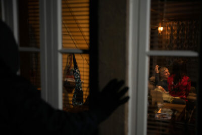 A mystery figure watches through the window as Leyla and Caleb kiss on Emmerdale