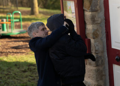 Caleb grapples with a hooded figure on Emmerdale