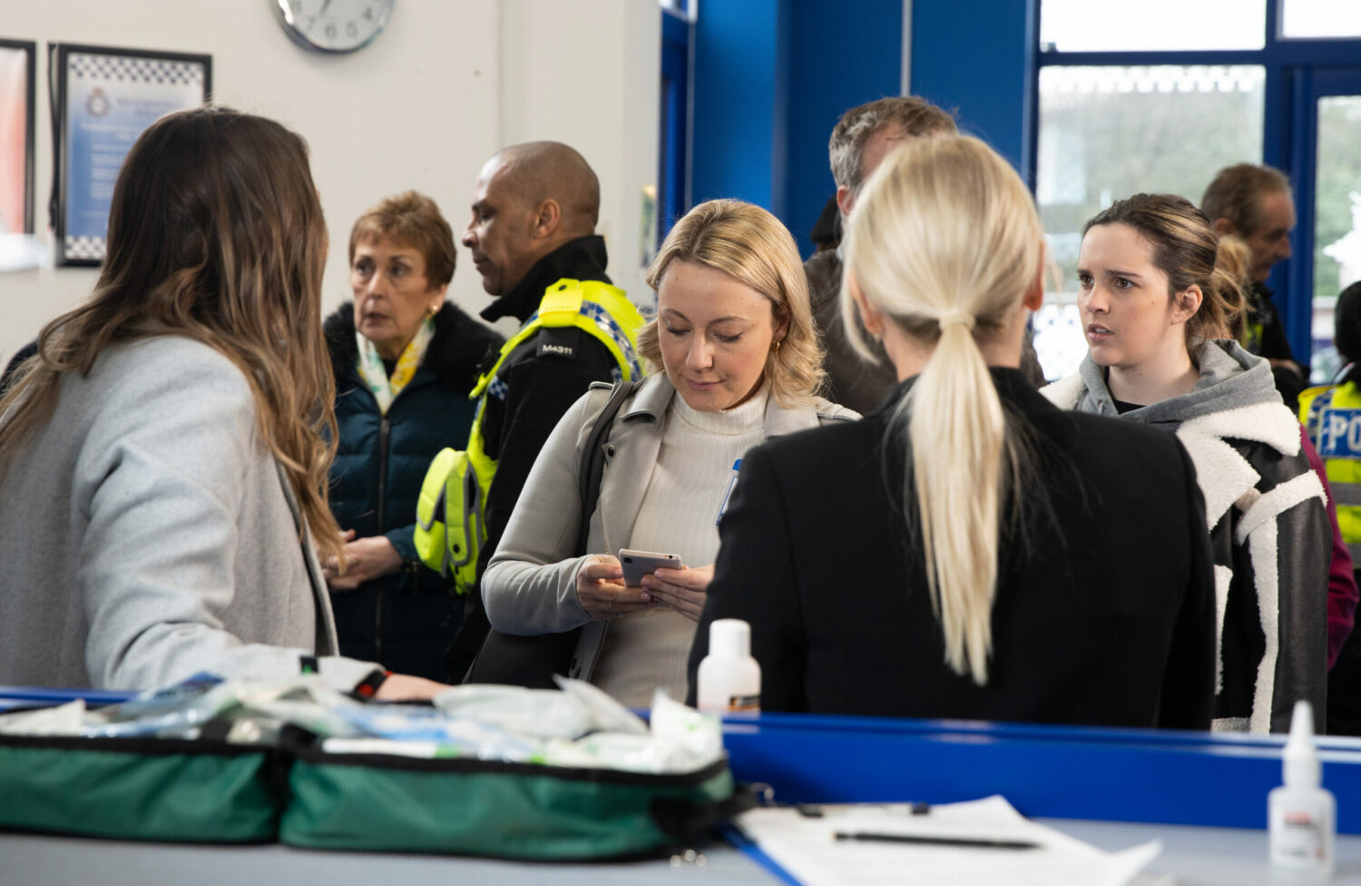 Amy is horrified in a busy police station as Tracy is about to give an interview in Coronation Street.
