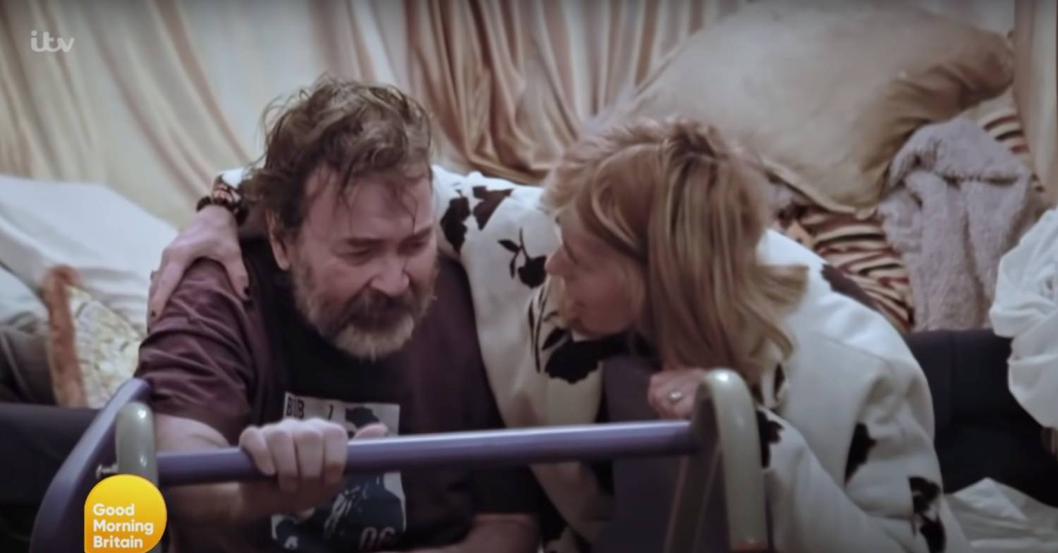 Kate Garraway assists her husband Derek Draper