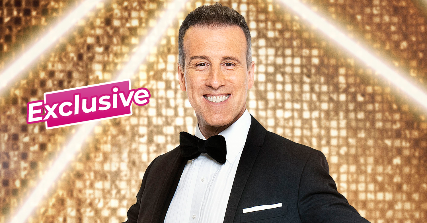 Anton Du Beke smiling in front of a gold glitter wall
