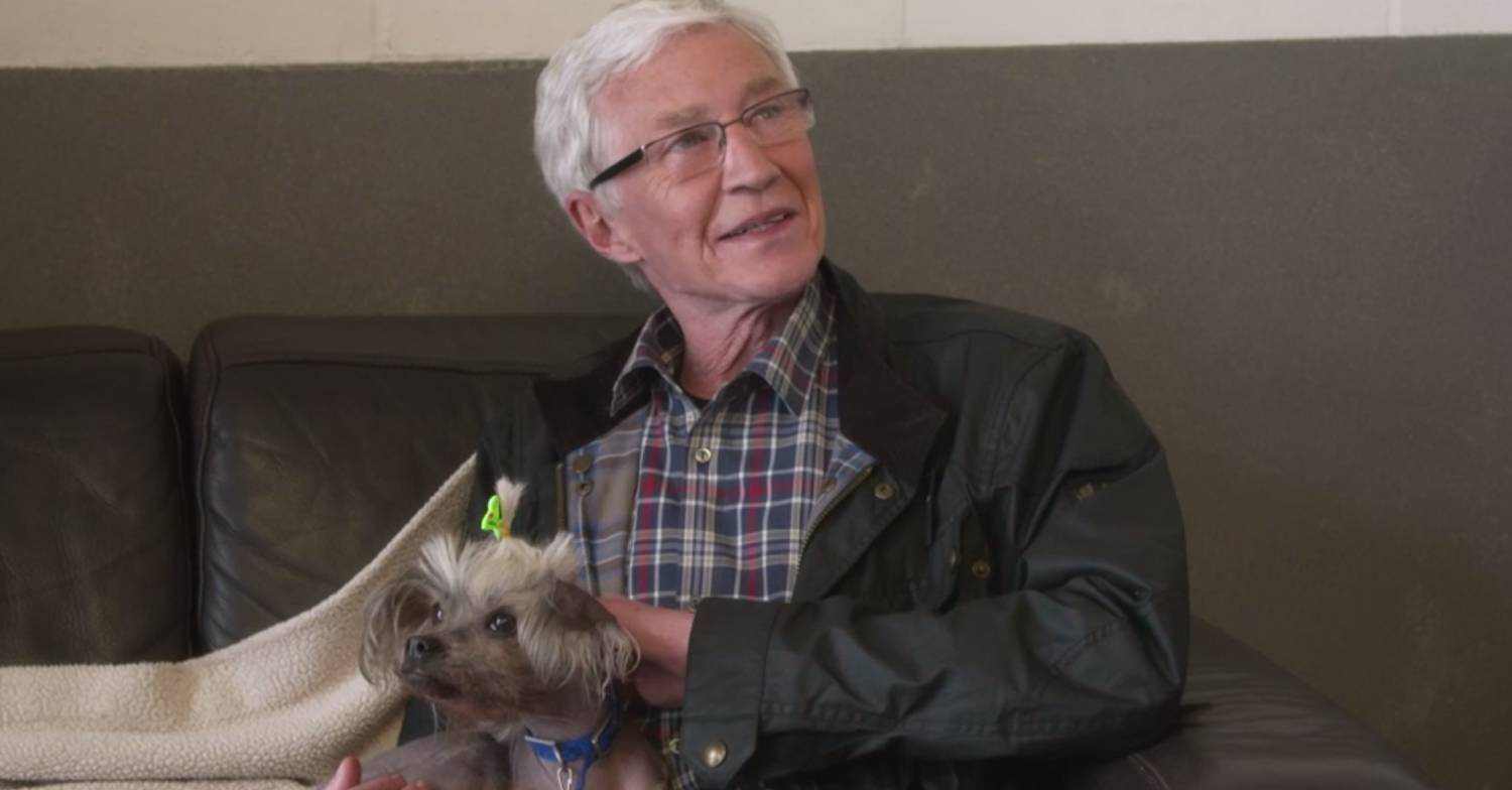 Paul O'Grady pets a dog