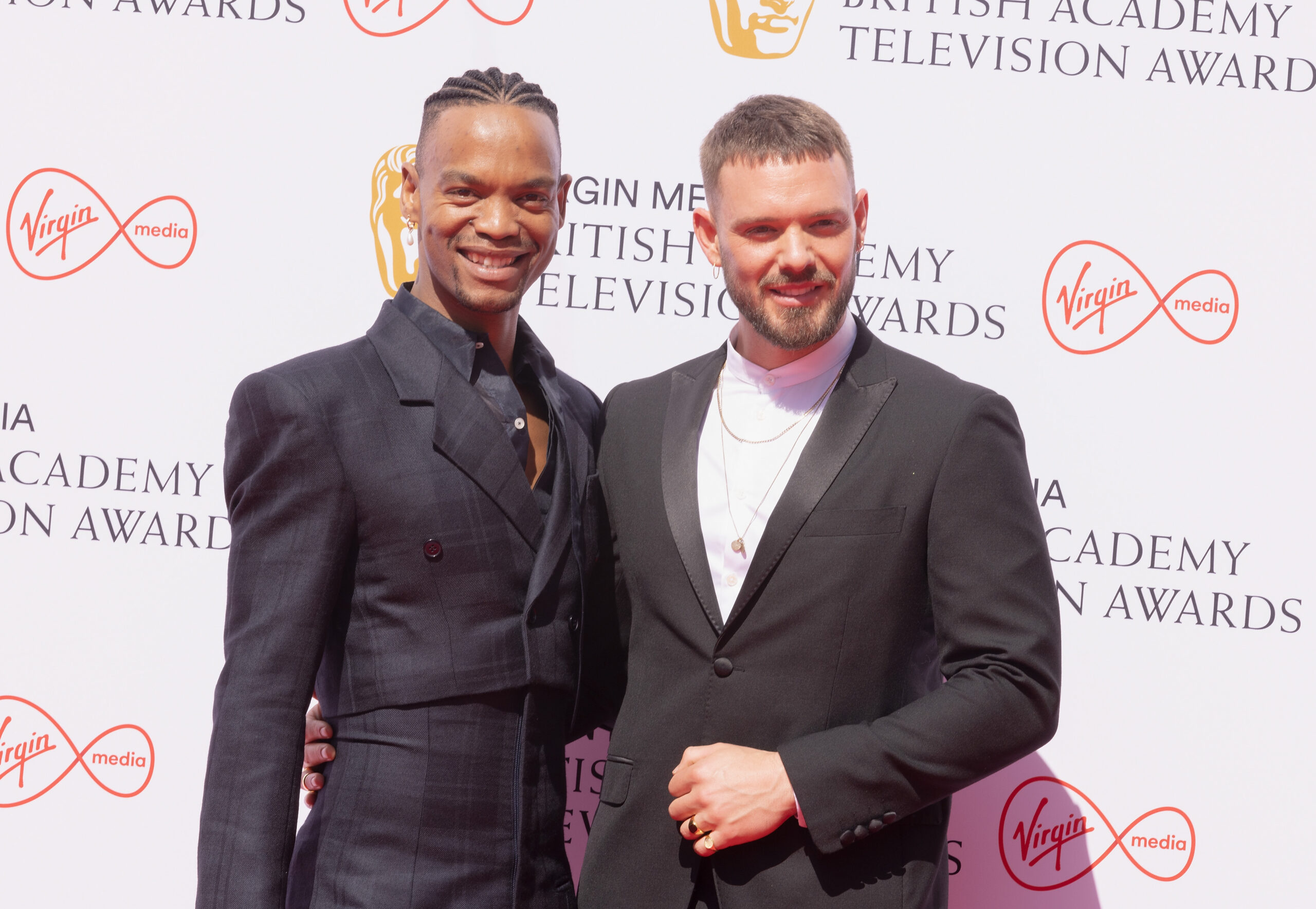 Johannes Radebe and John Whaite standing together on the red carpet