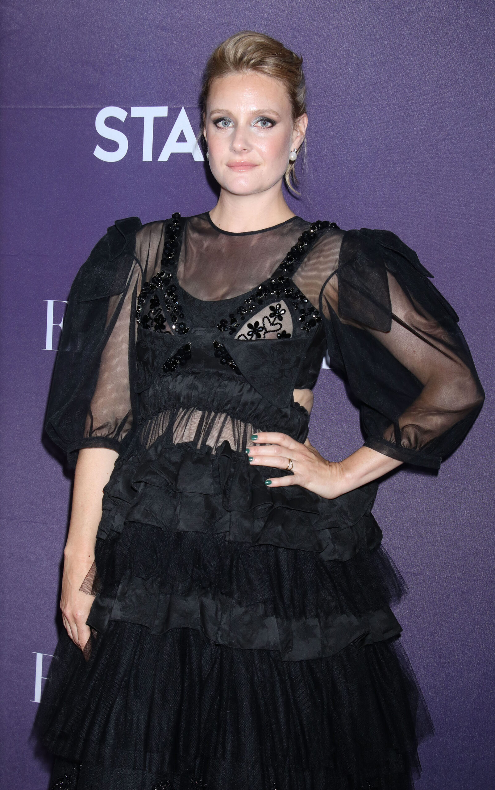 Romola Garai in sheer black dress at red carpet event