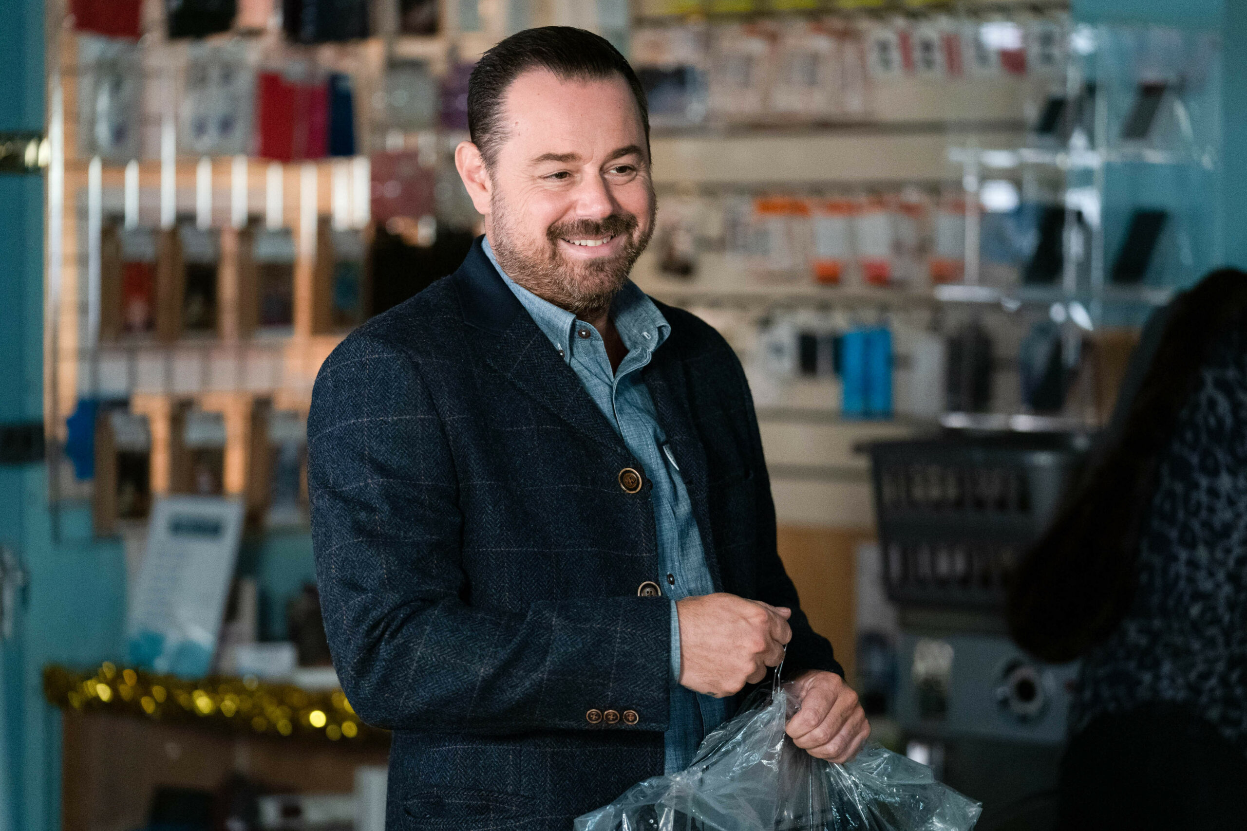 Mick Carter smiles on EastEnders