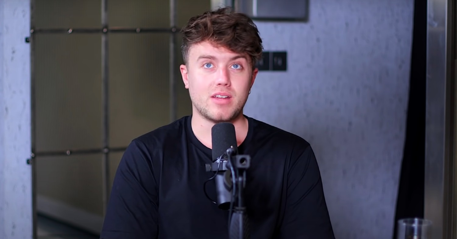 Roman Kemp looking up during a podcast