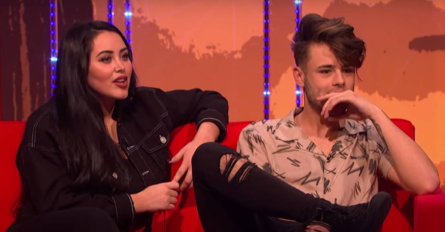 Marnie Simpson sits with her partner