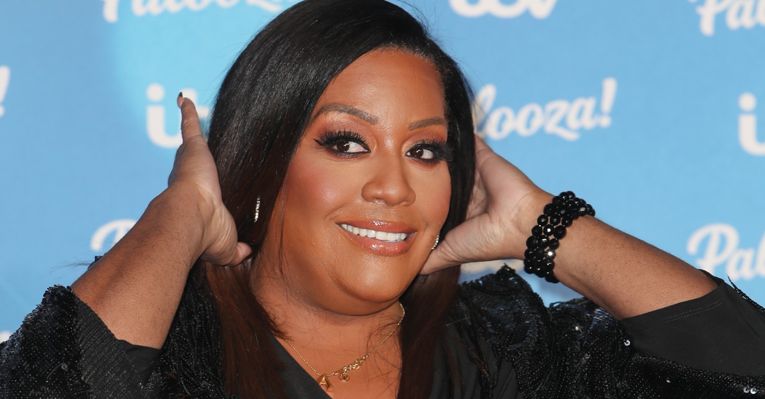Alison Hammond smiling on a red carpet 