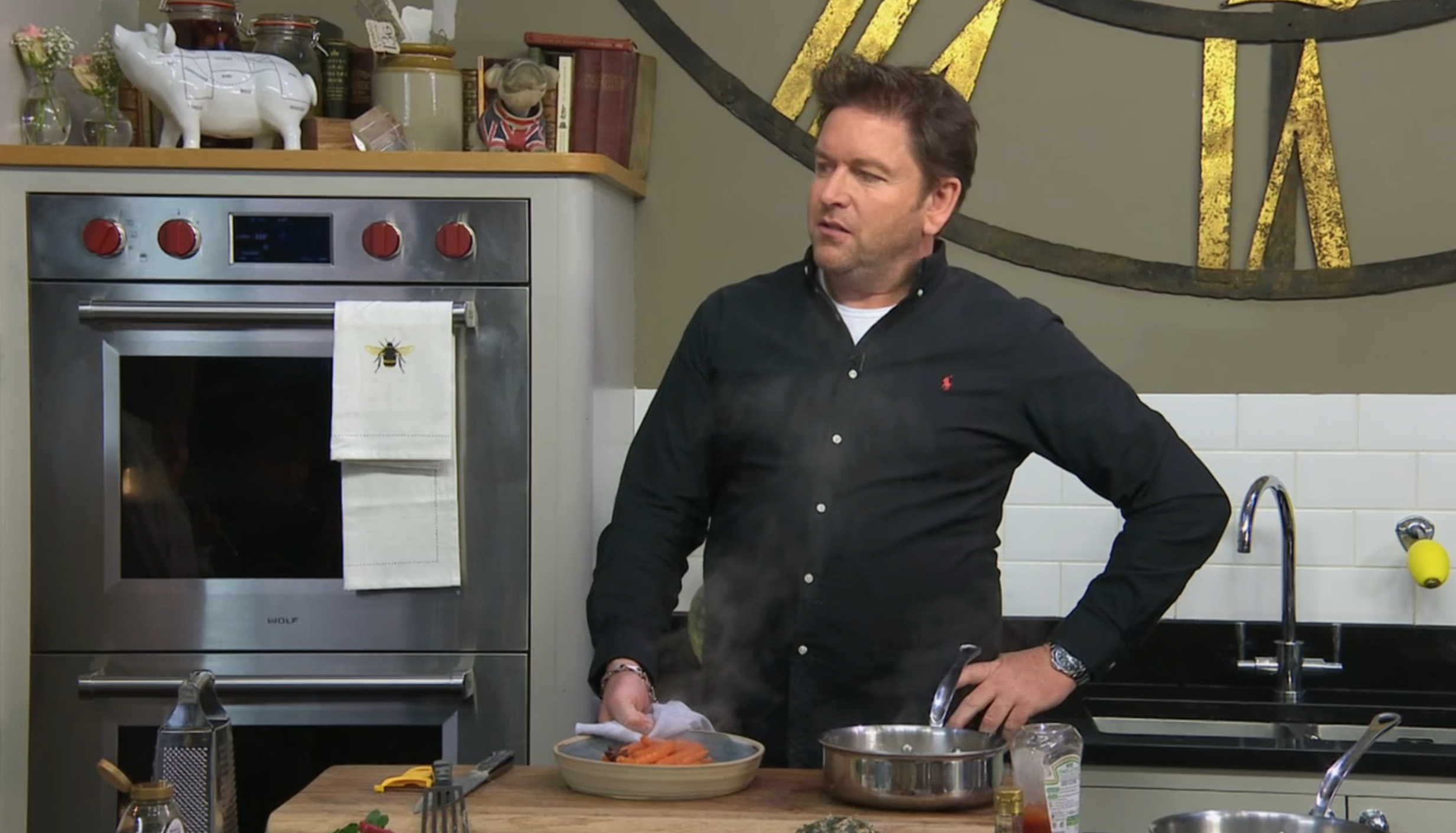 James Martin standing with his hand on his hip