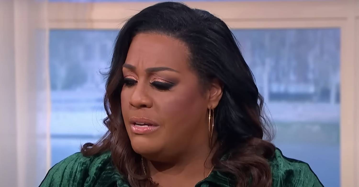 Alison Hammond looks downwards