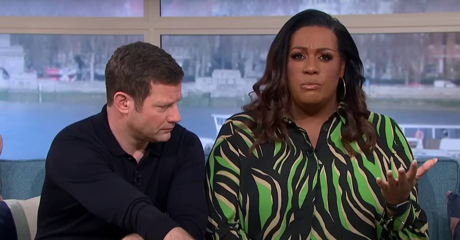 Alison Hammond looks at the camera as Dermot O'Leary sits beside her