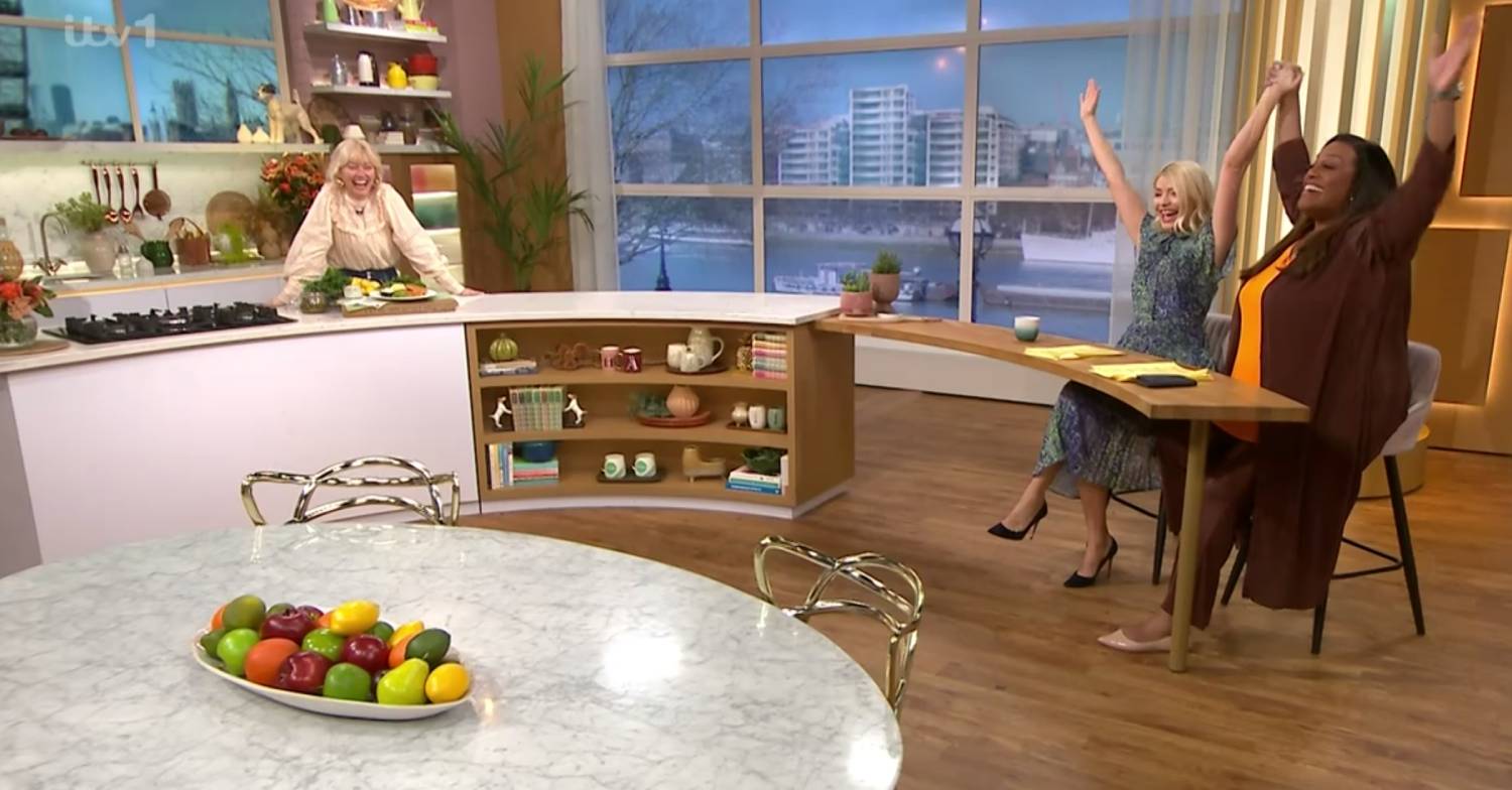 Holly Willoughby and Alison Hammond wave their arms in the air on This Morning today
