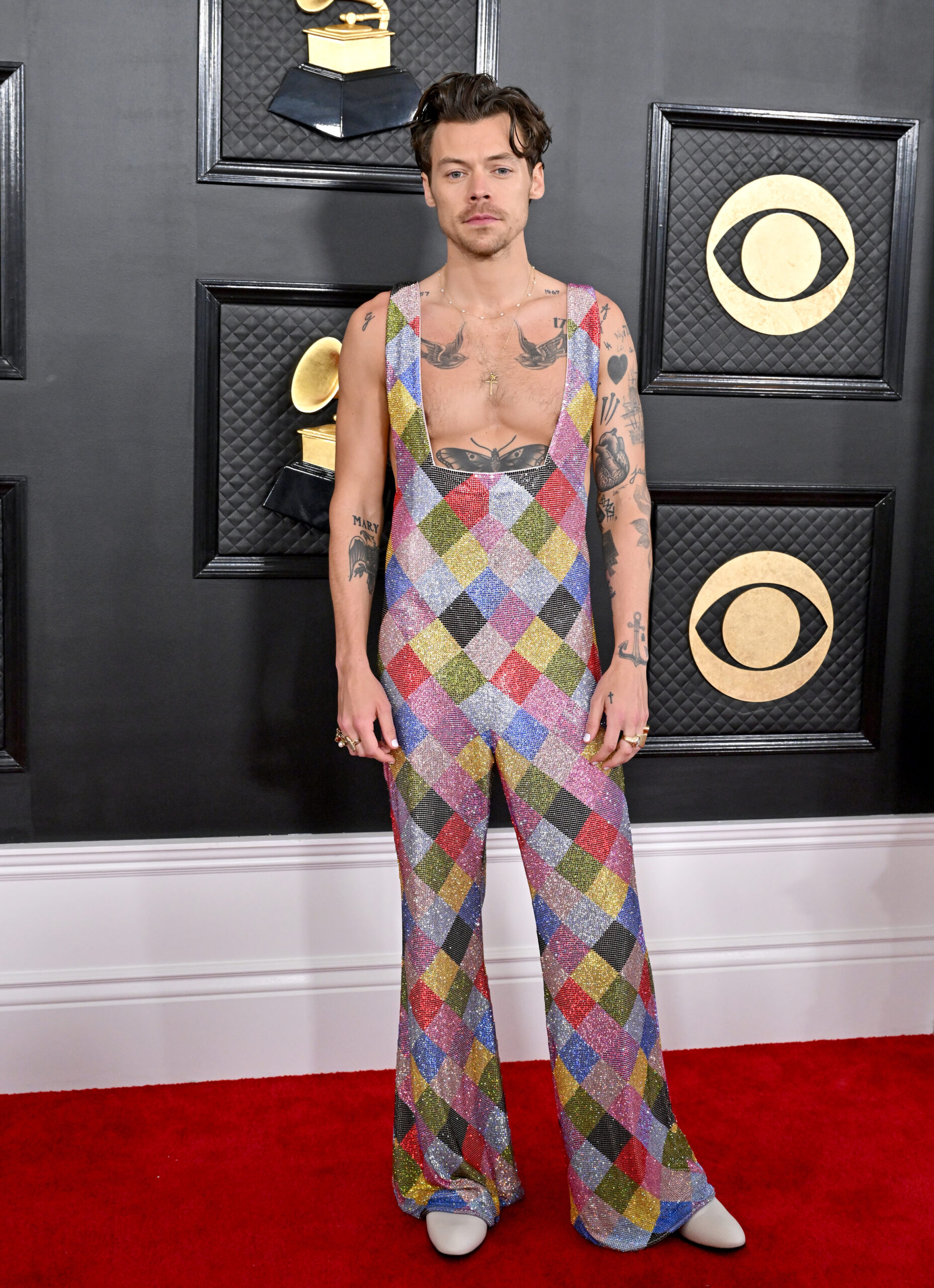 Harry Styles poses at the 2022 Grammys