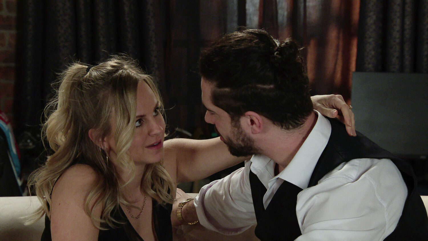 Sarah drapes her arm seductively around husband Adam Barlow 