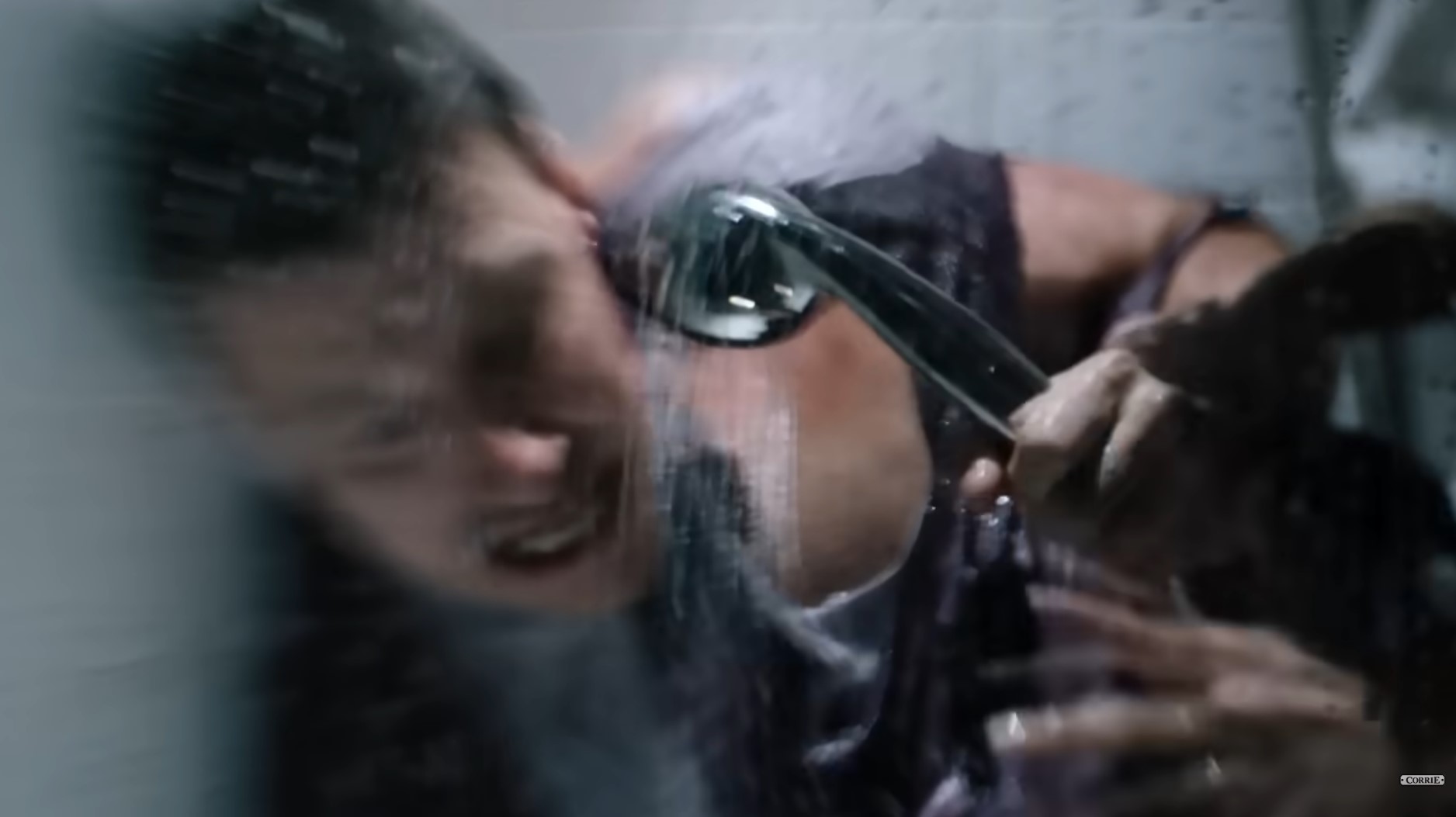 Coronation Street's Ryan Connor holds a shower over himself after the acid attack