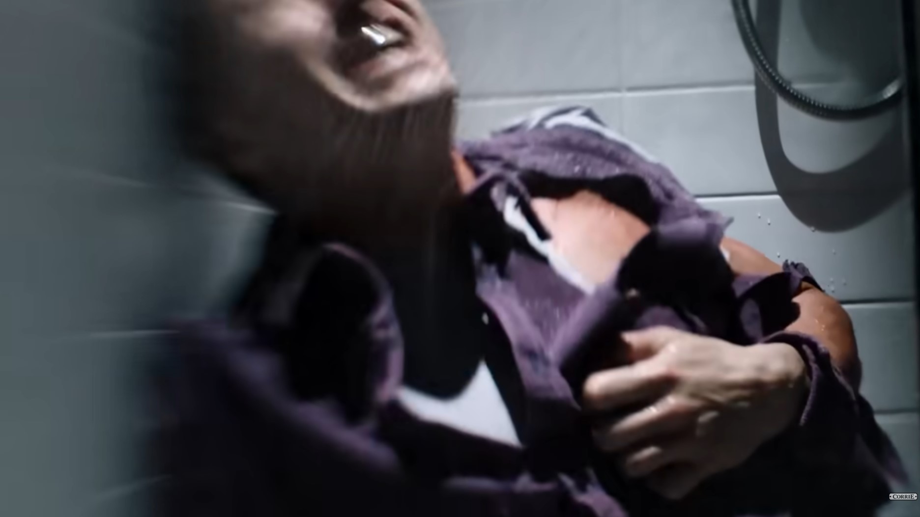 Coronation Street's Ryan grabs his ripped shirt screaming in pain in the shower