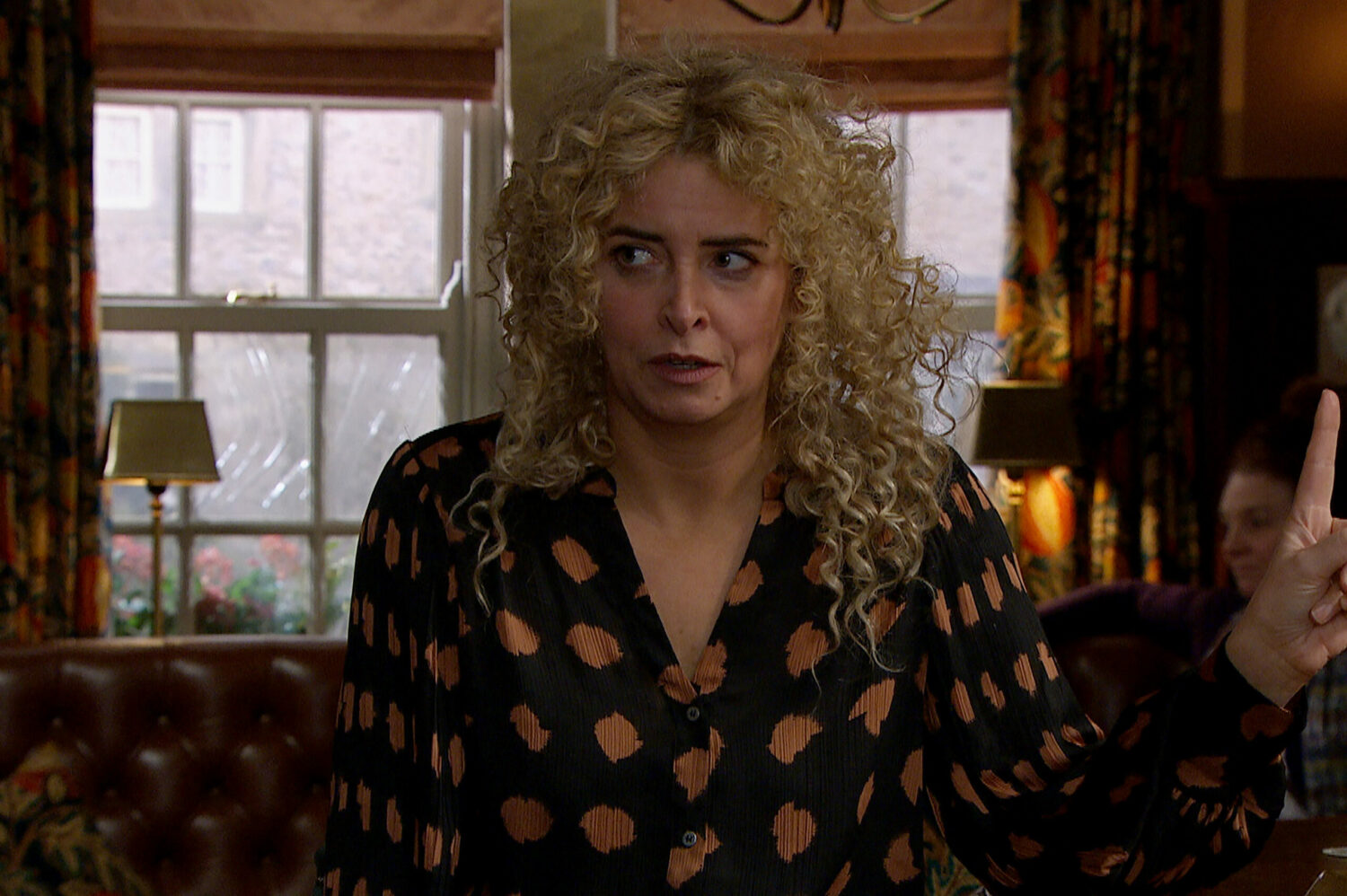 Charity Dingle is angry as she shows the pub her poodle hair do
