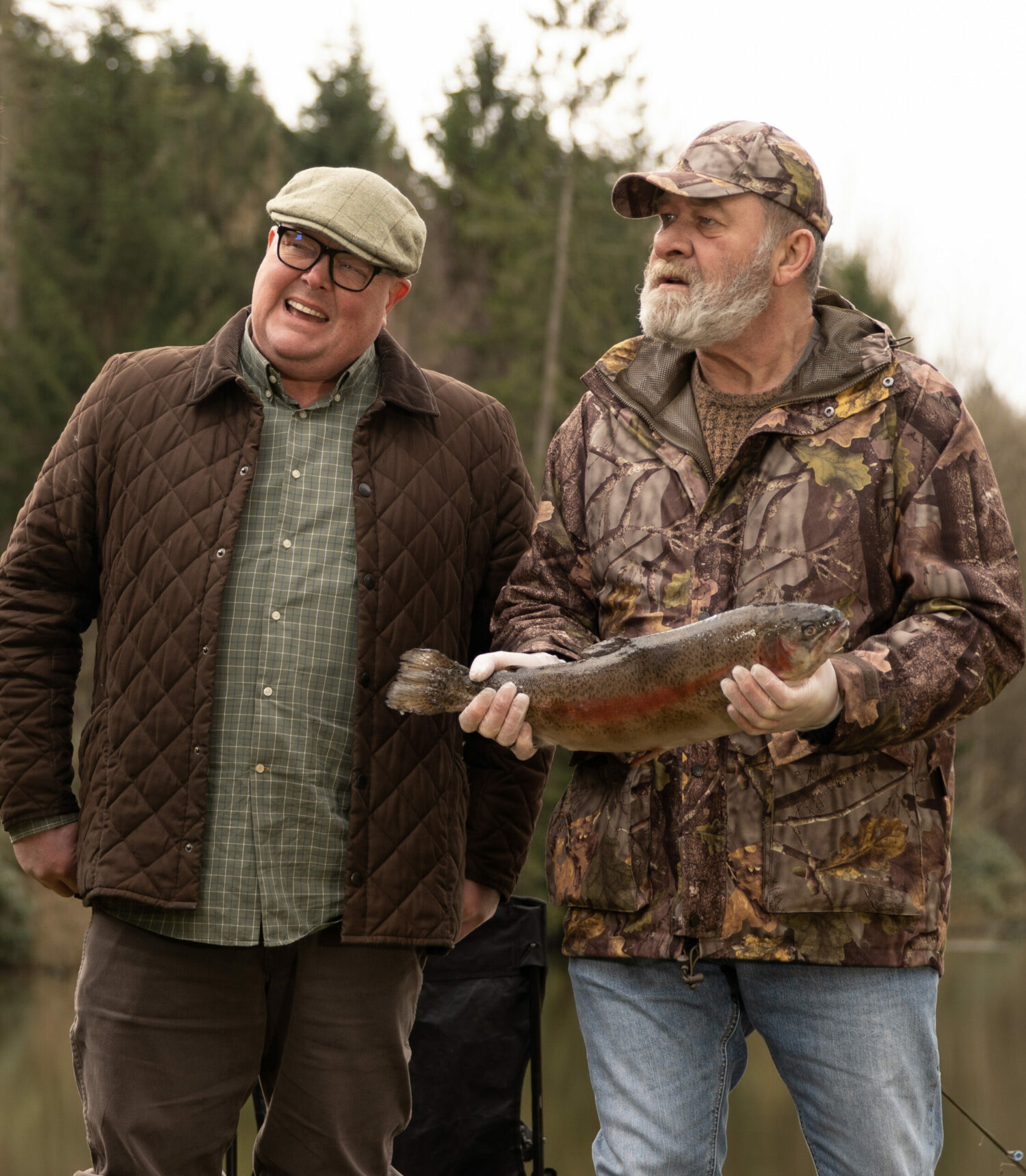 Paddy and Bear wearing fishing gear on a trip together on Emmerdale