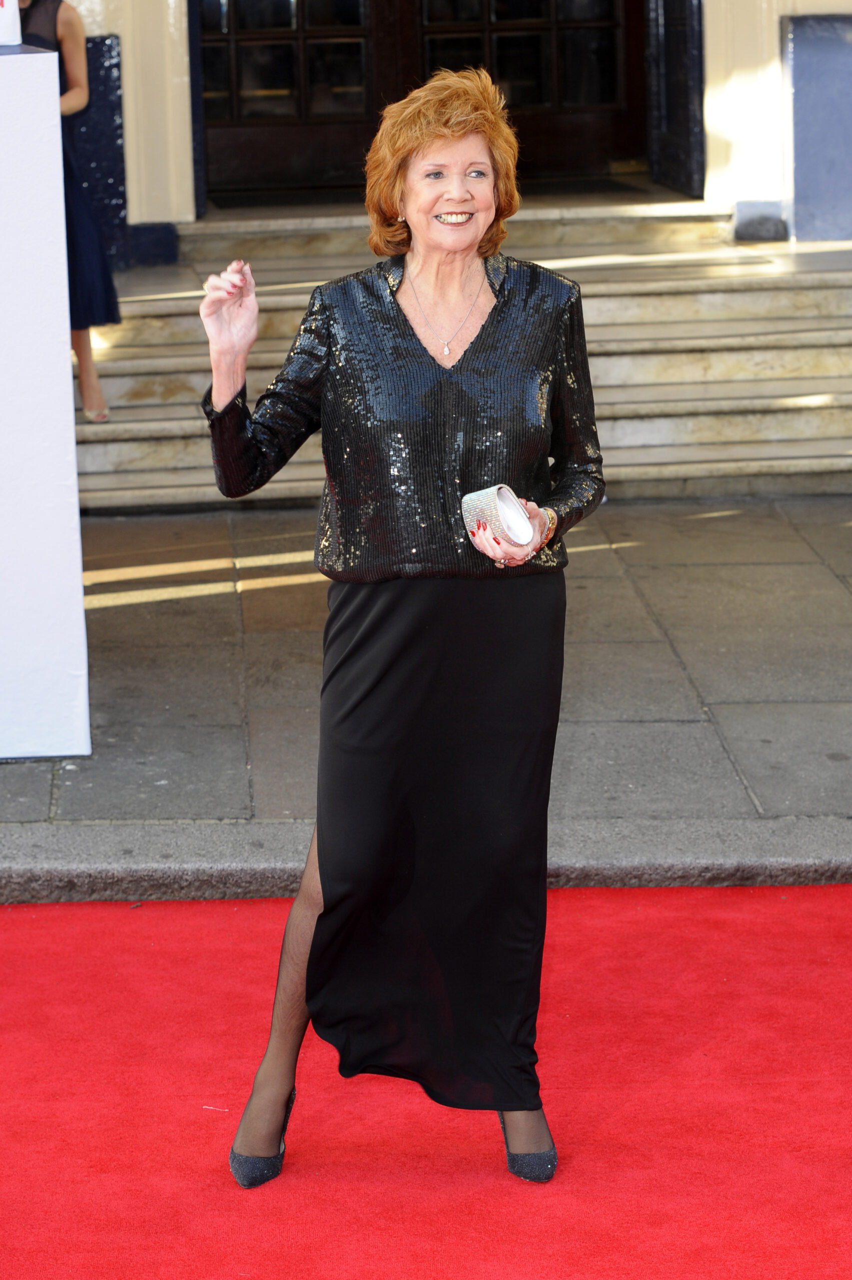 Cilla Black posing on red carpet 