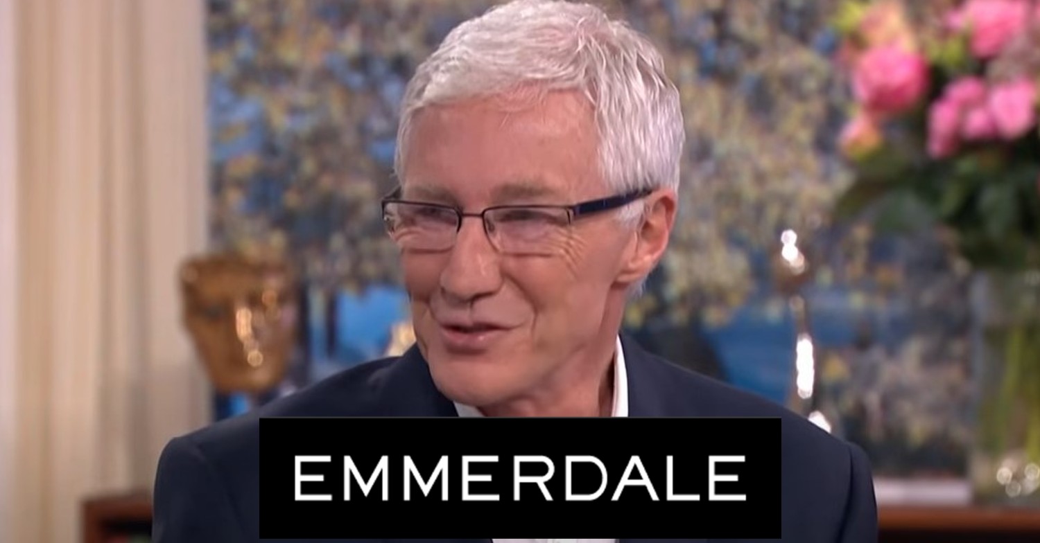Paul O'Grady smiles with the Emmerdale logo comp image