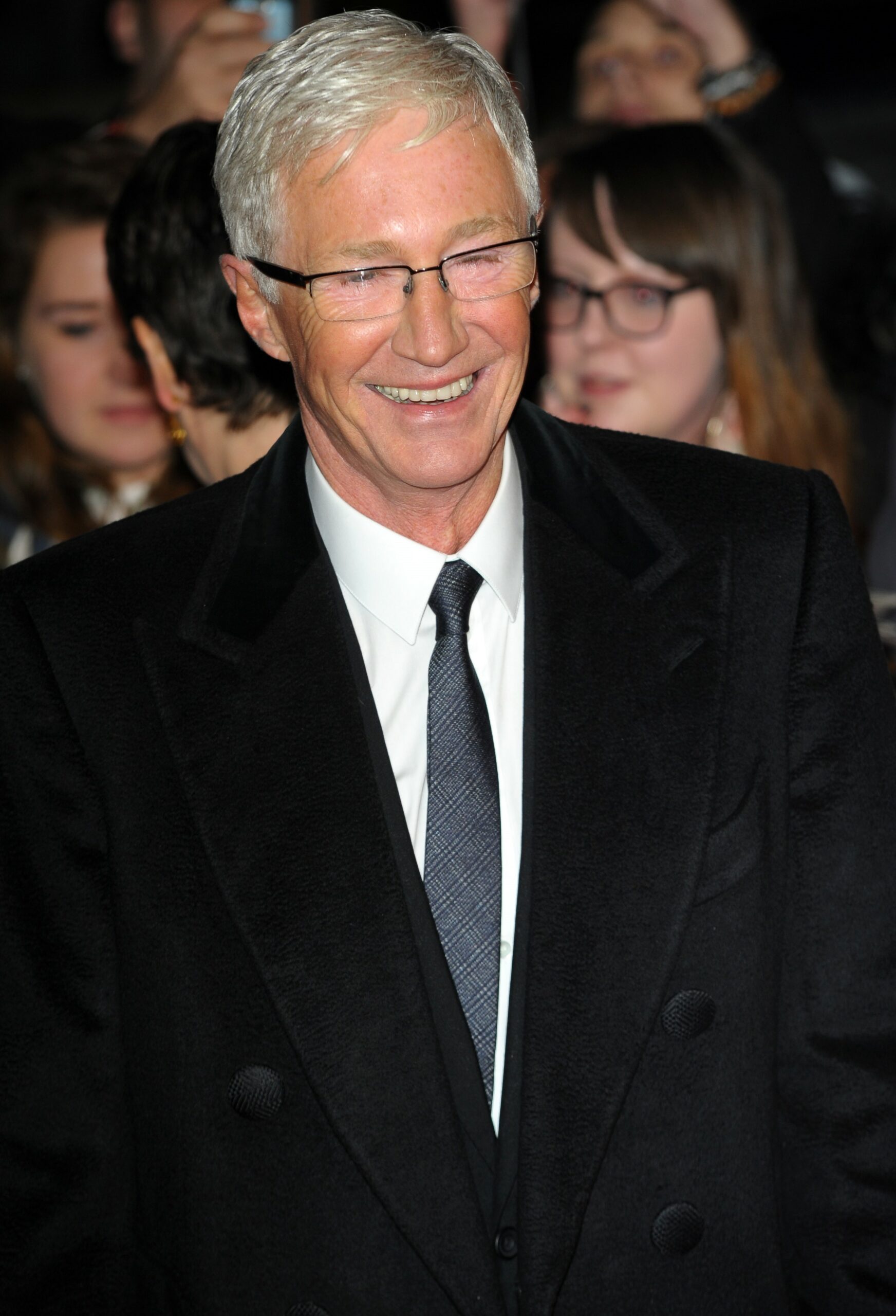 Paul O'Grady in black suit, smiling at NTAs