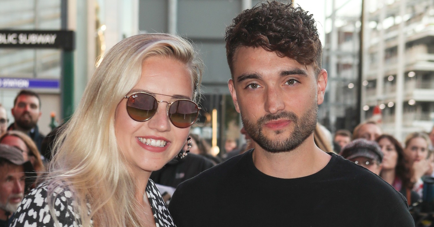 Kelsey Parker wearing sunglasses with husband Tom Parker next to her