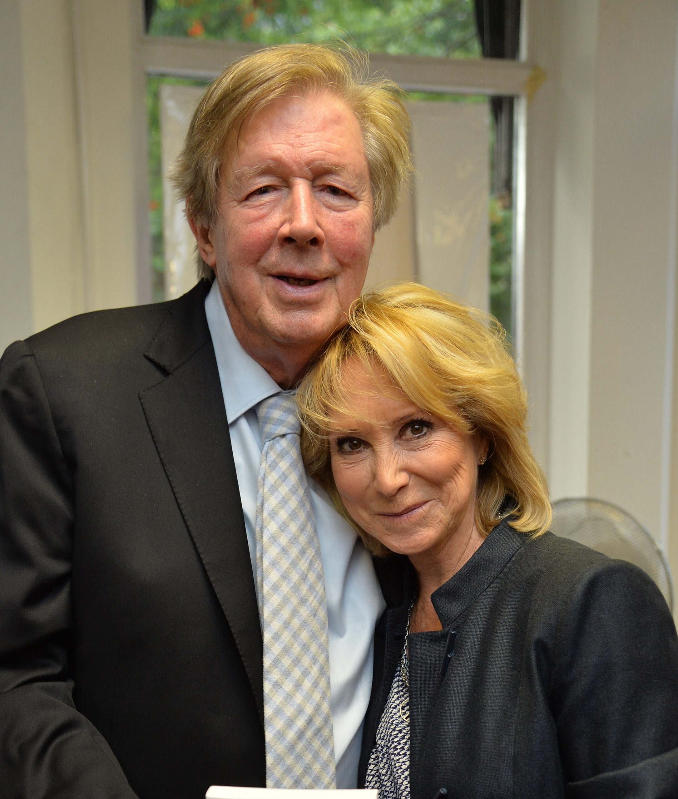 Felicity Kendal and Michael Rudman smiling at event
