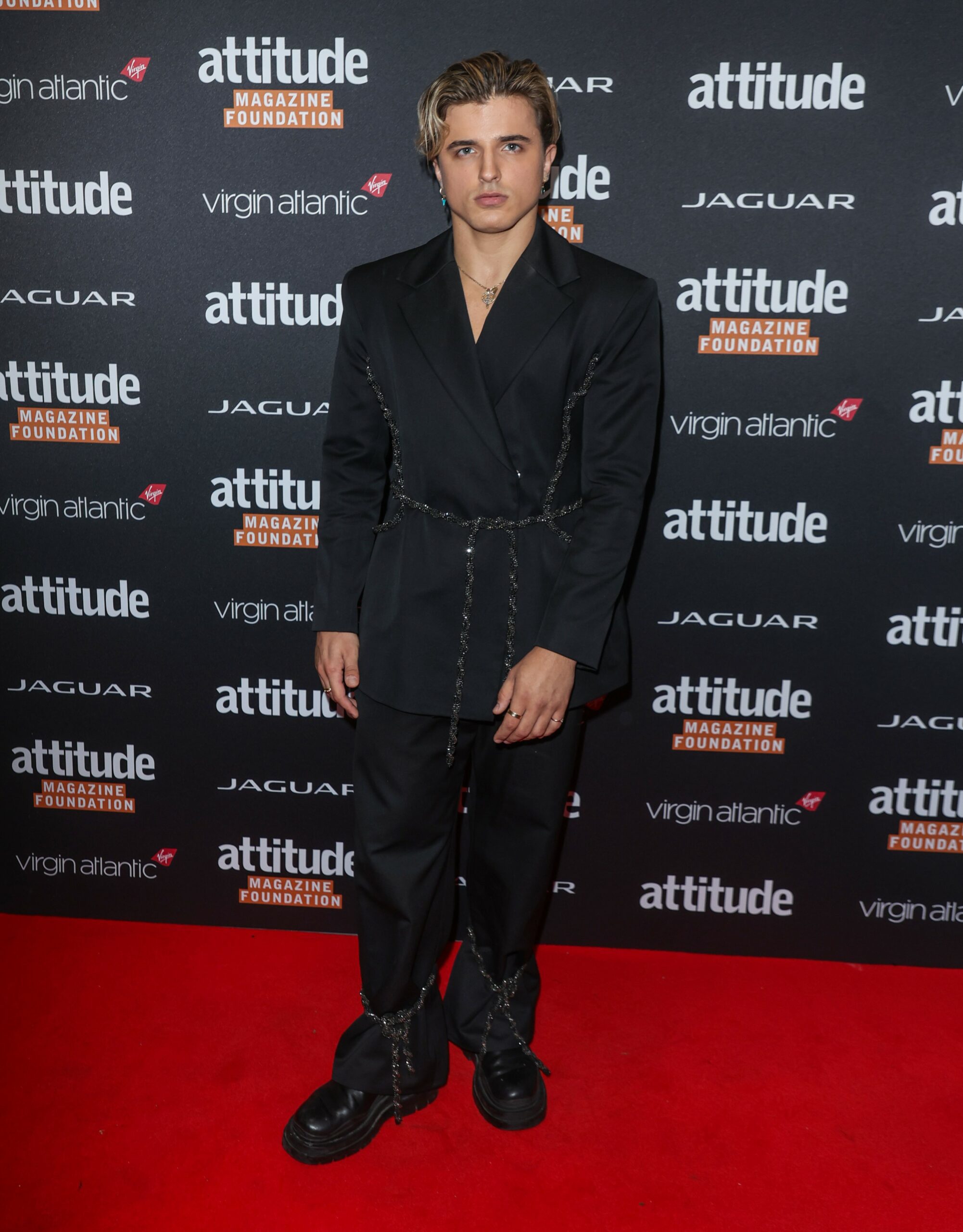 Nikita Kuzmin posing on red carpet