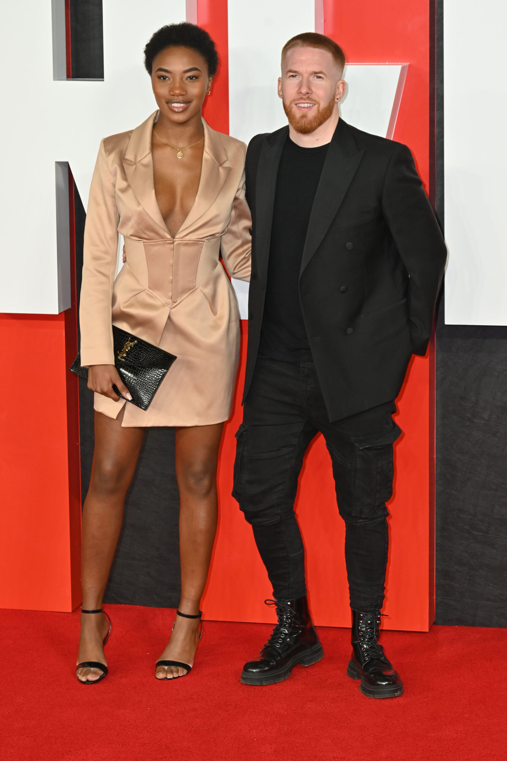 Neil Jones and Chyna Mills posing on the red carpet
