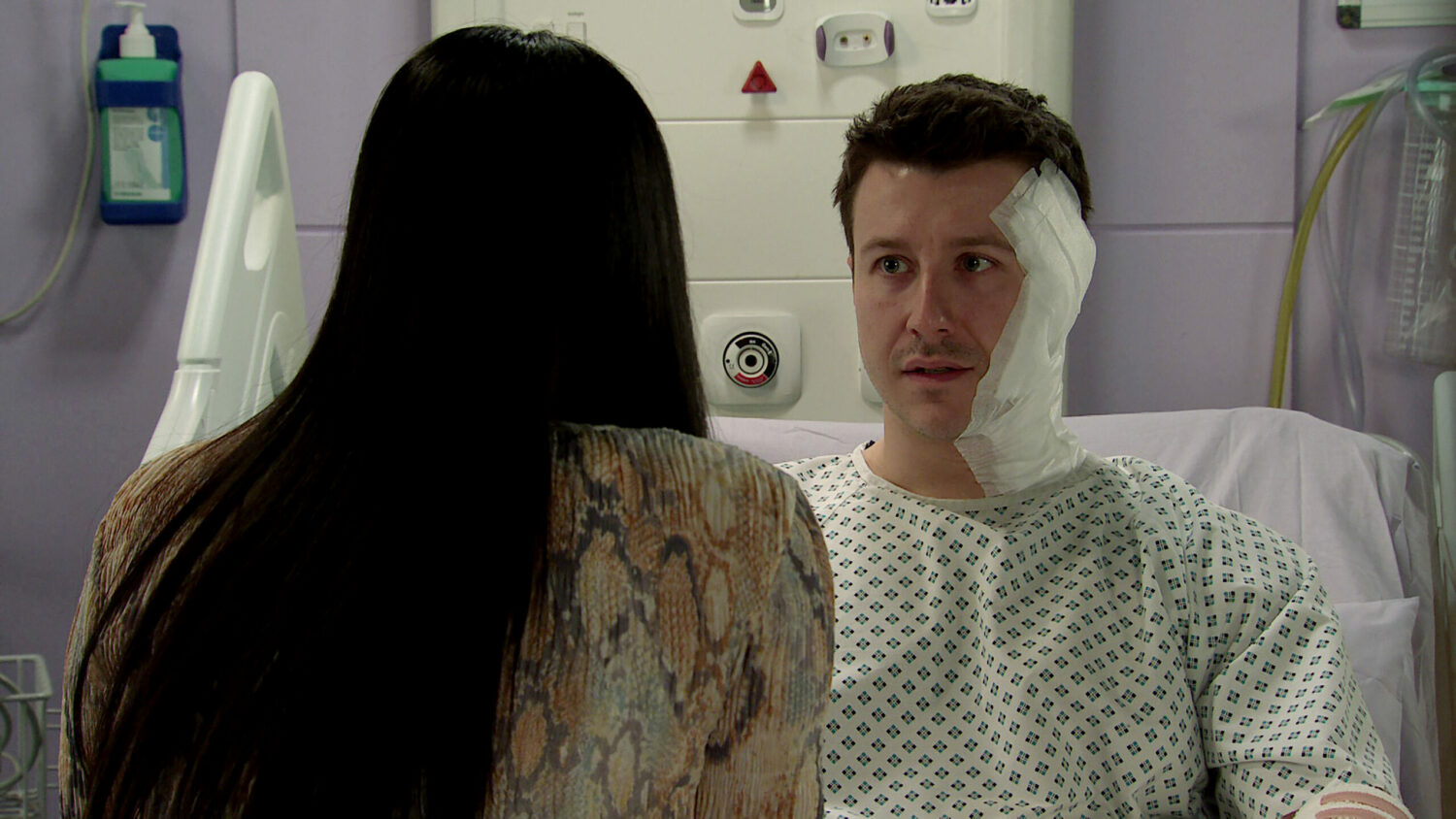 Coronation Street's Ryan looks anxious as he talks to Alya in hospital.