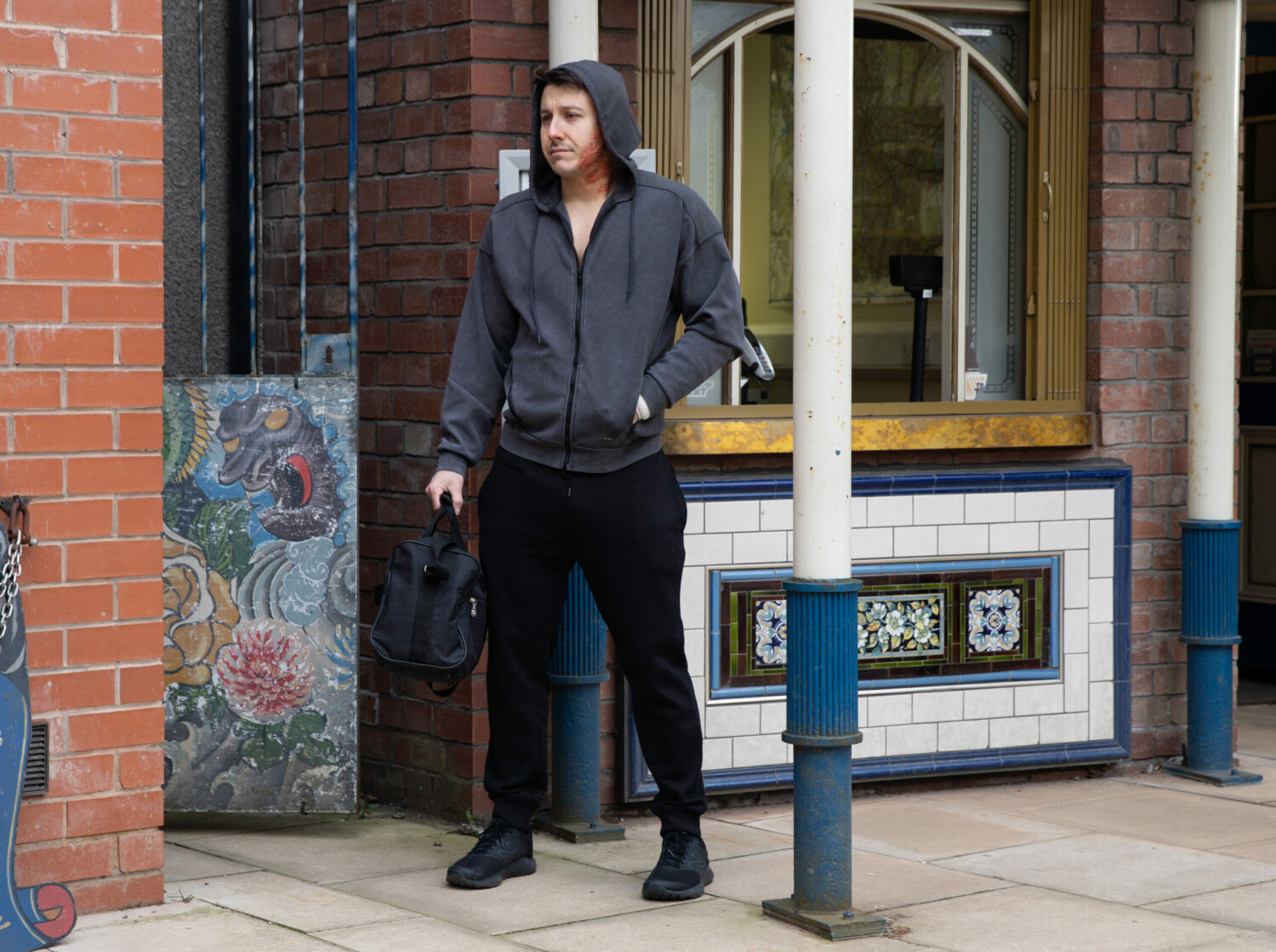 Ryan looks upset as he heads to the tram station in Coronation Street