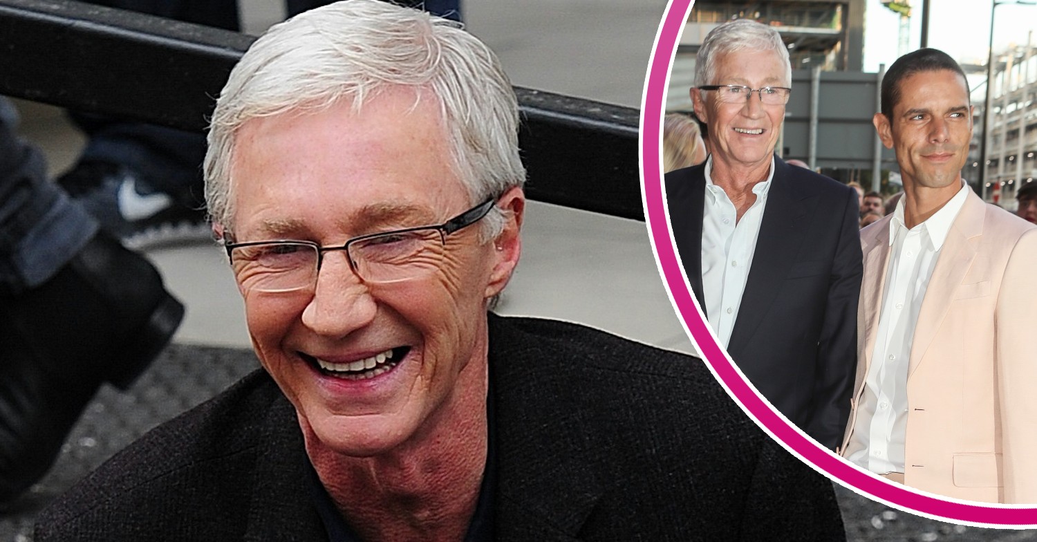 Paul O'Grady smiling outside ITV Studios, Paul smiling with husband Andre