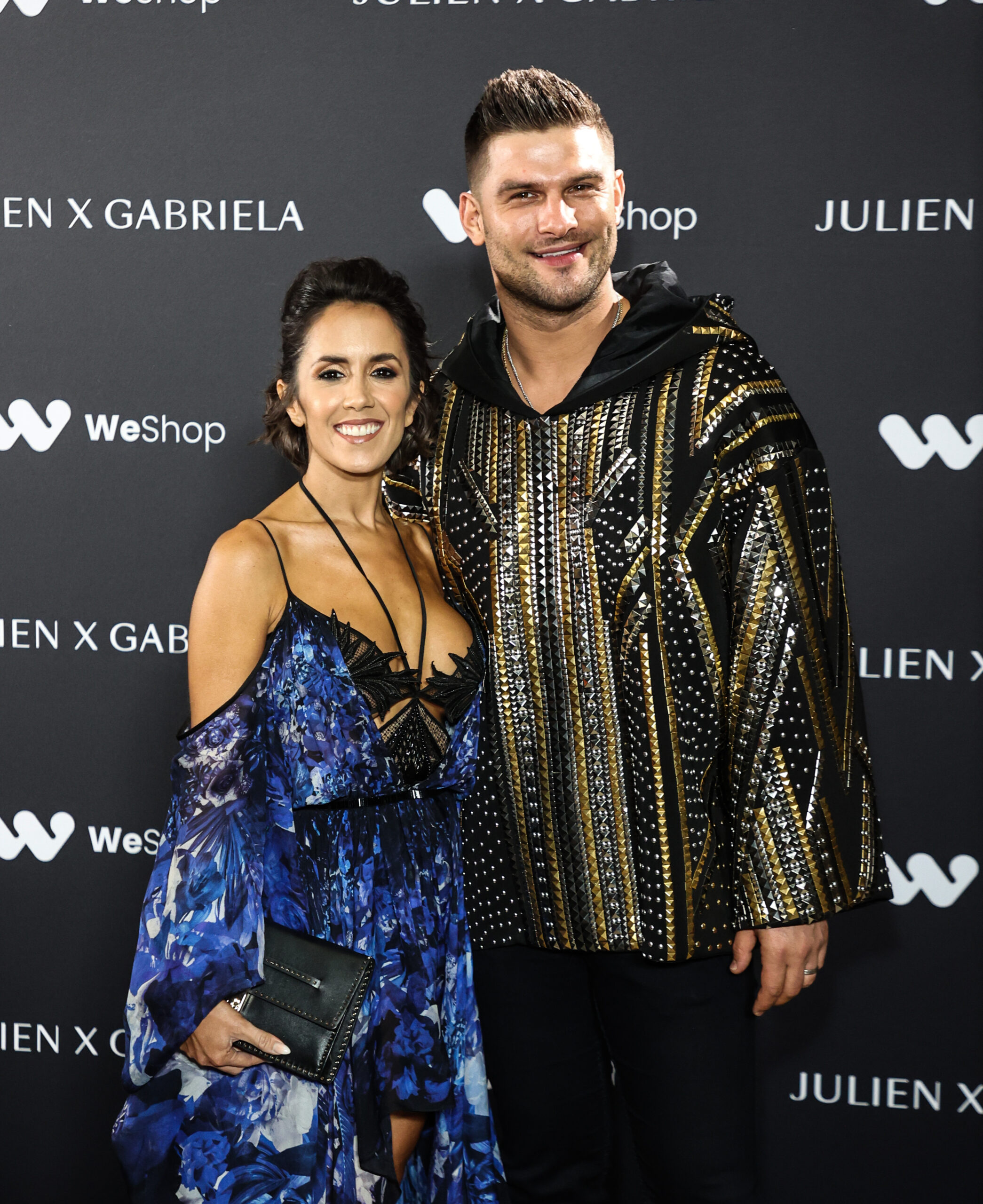 Janette Manrara and Aljaz Skorjanec smiling on the red carpet