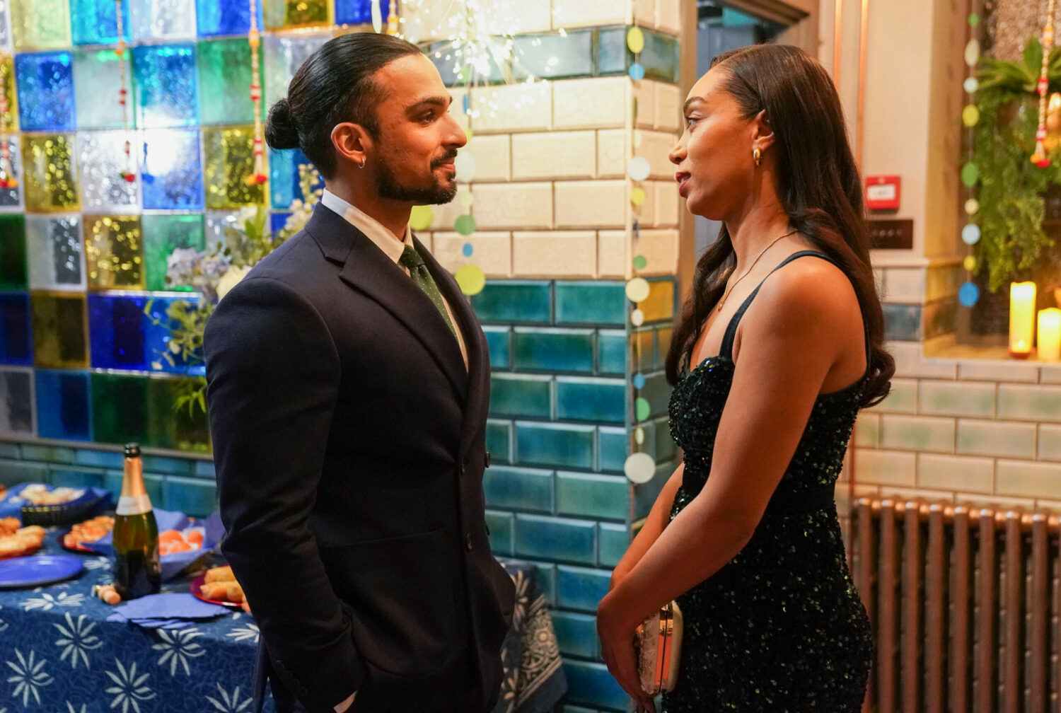 Ravi talks to a glammed-up looking Chelsea on EastEnders
