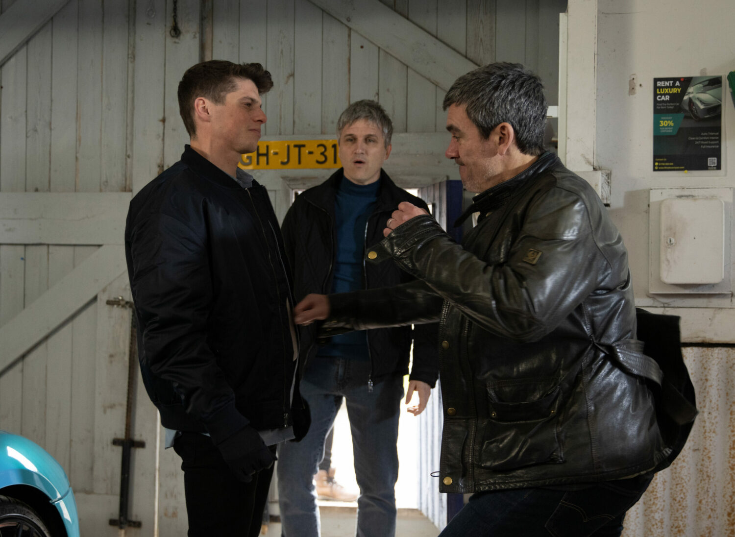 Emmerdale's Cain is about to punch Nicky as Caleb watches on in the garage