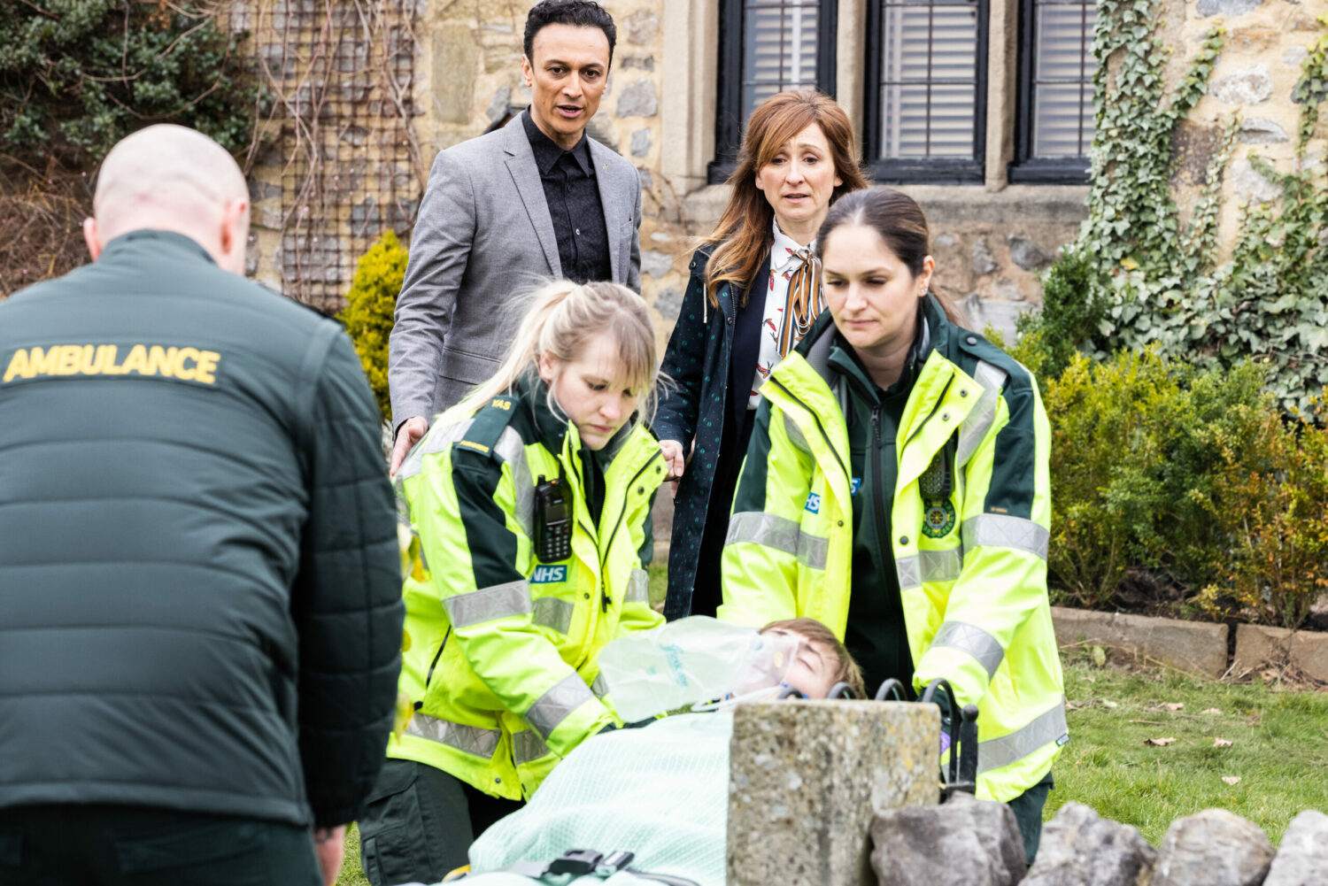 Parademics in Emmerdale lead Marshall away while Laurel and Jai worriedly watch on