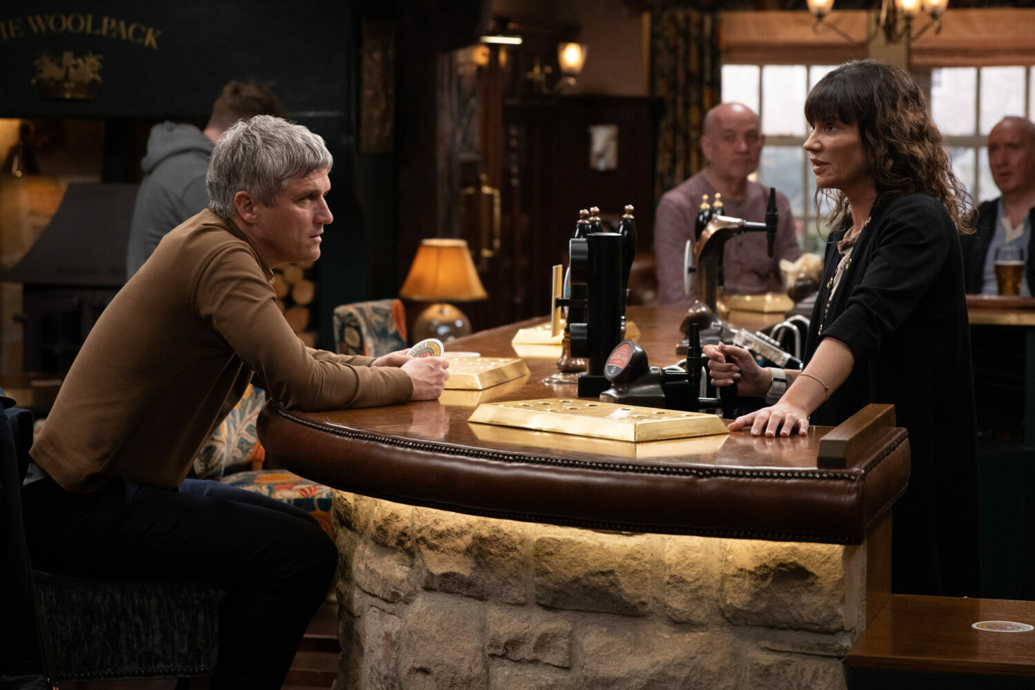 Caleb and Chas talk at the bar on Emmerdale