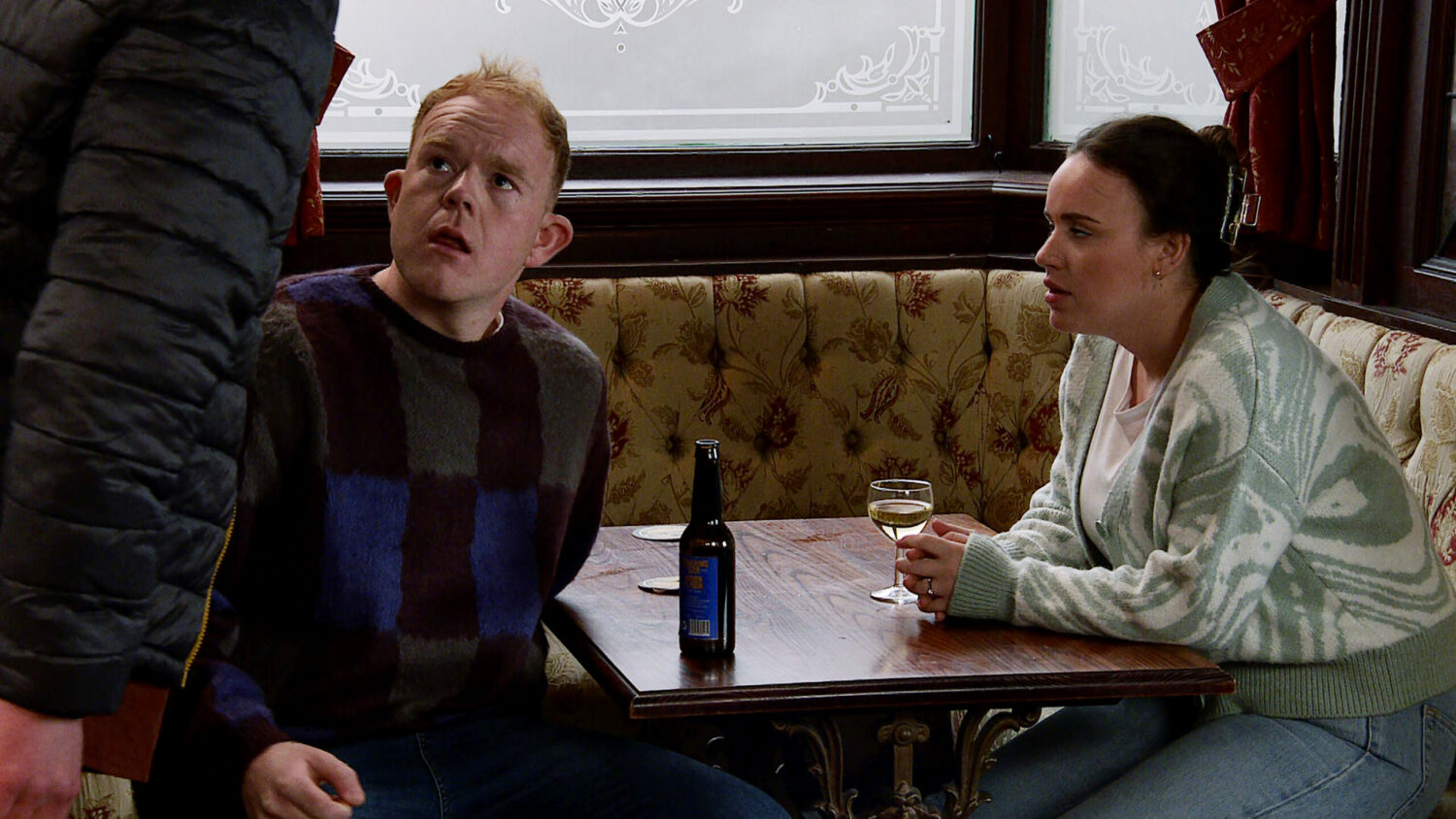 Craig looks shocked as he talks to Faye in the Rovers on Corrie