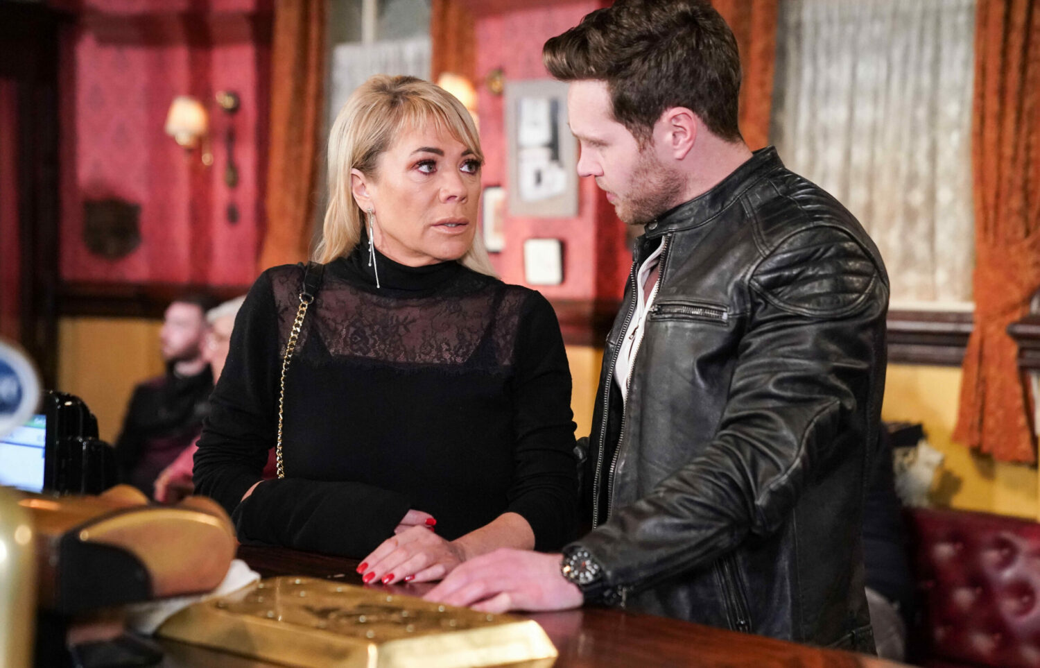 Keanu looks worried as he talks to Sharon on EastEnders