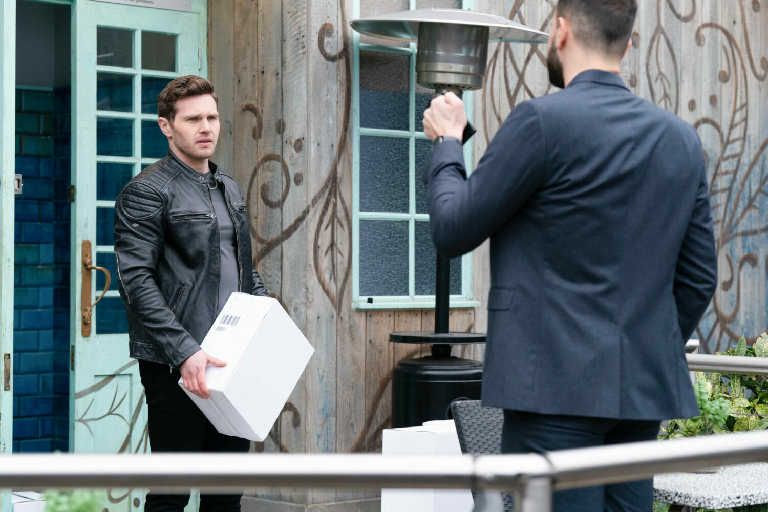 Keanu carrying a box, is approached by the police on EastEnders