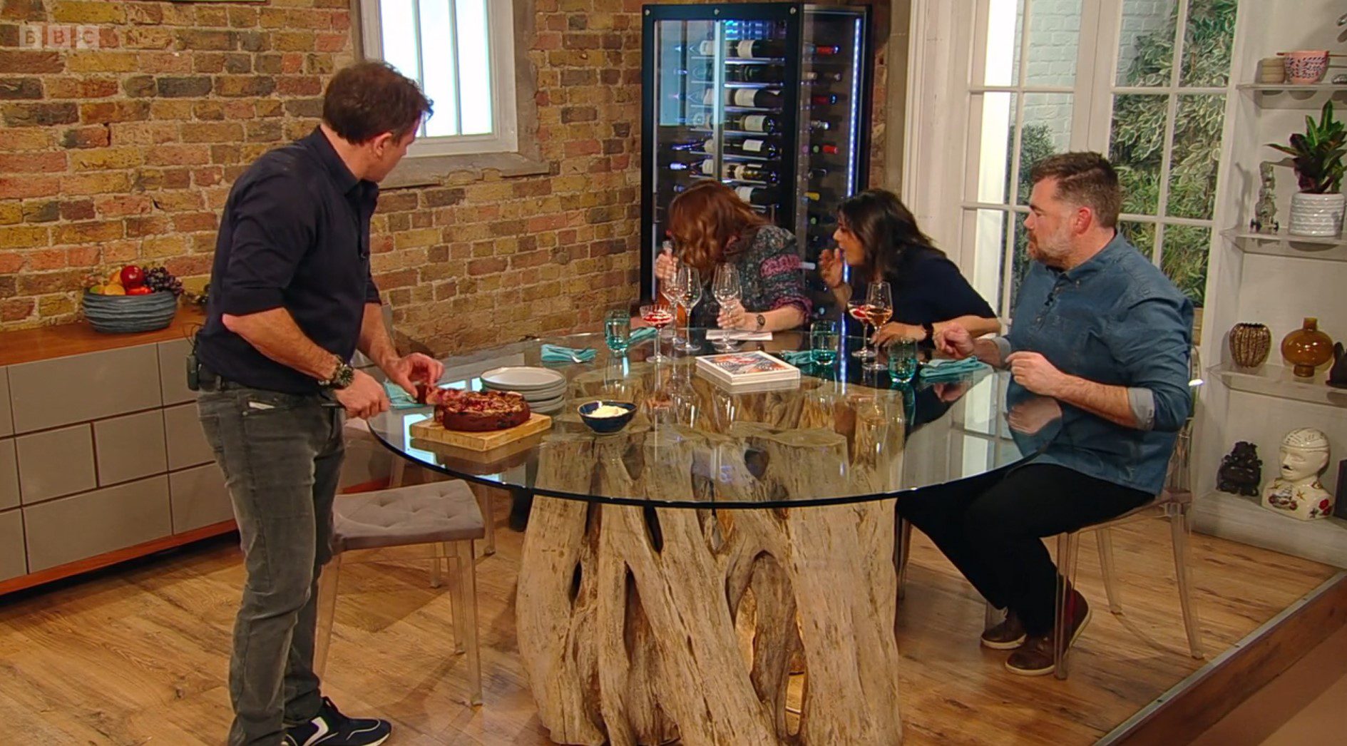 Matt Tebbutt, Hels and Nina Wadia look on as Alison falls to the floor on Saturday Kitchen