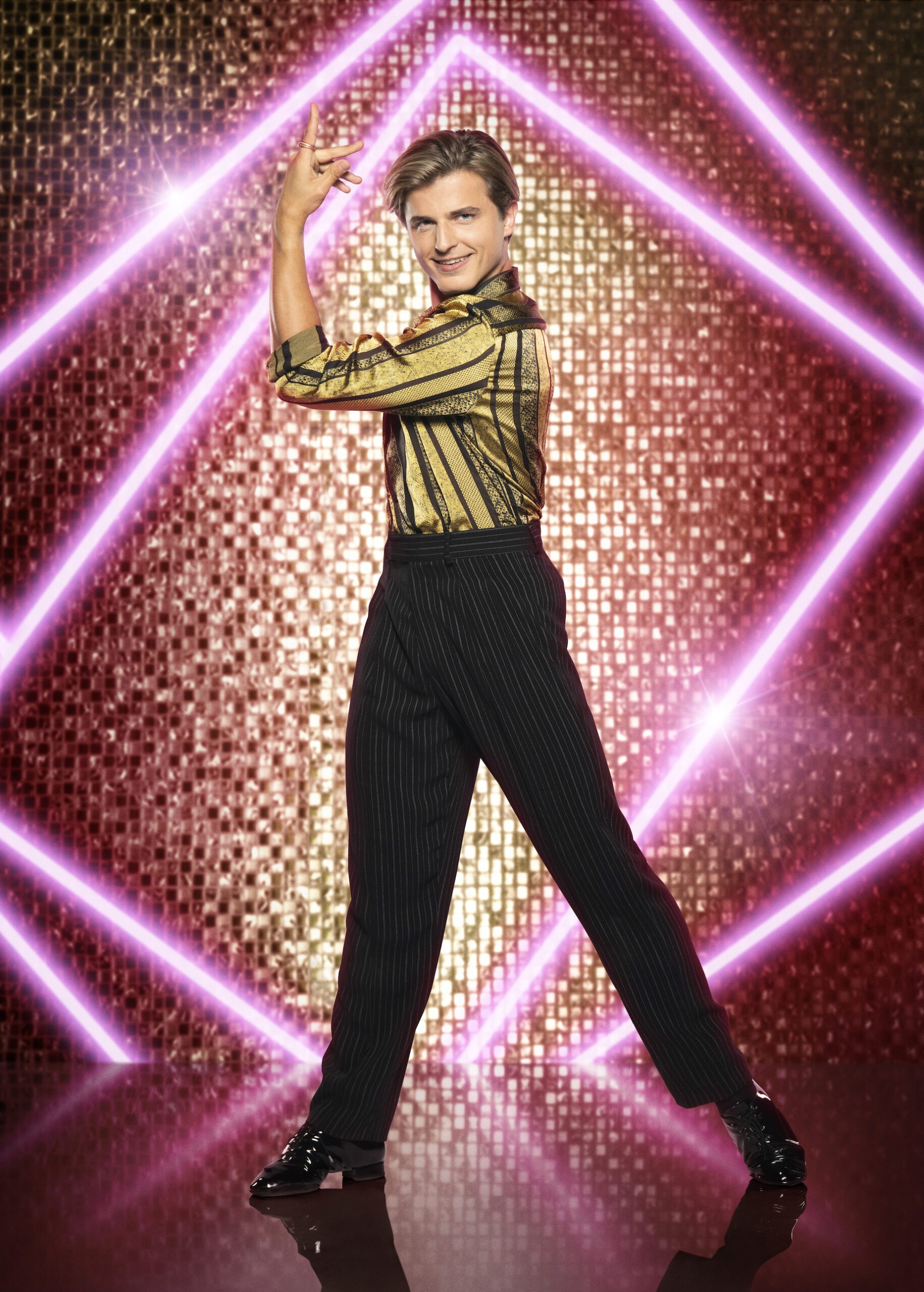 Strictly's Nikita Kuzmin in gold shirt 