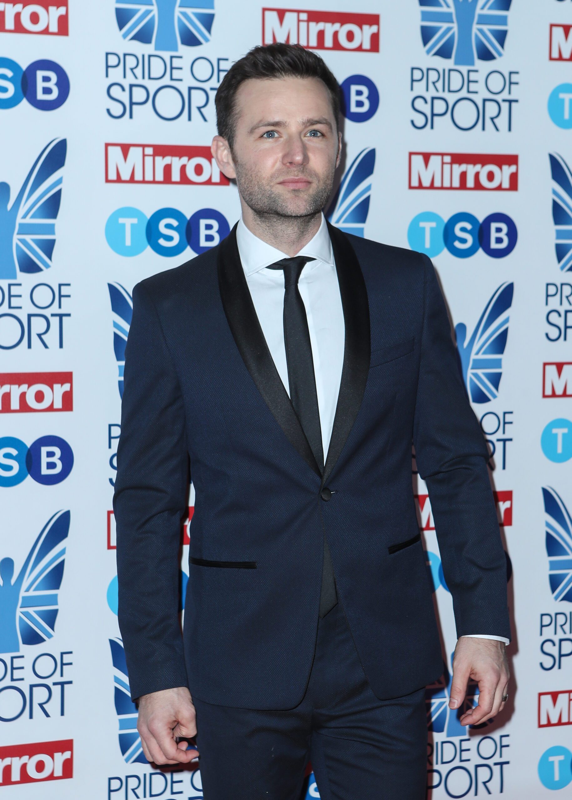 Harry Judd posing in suit