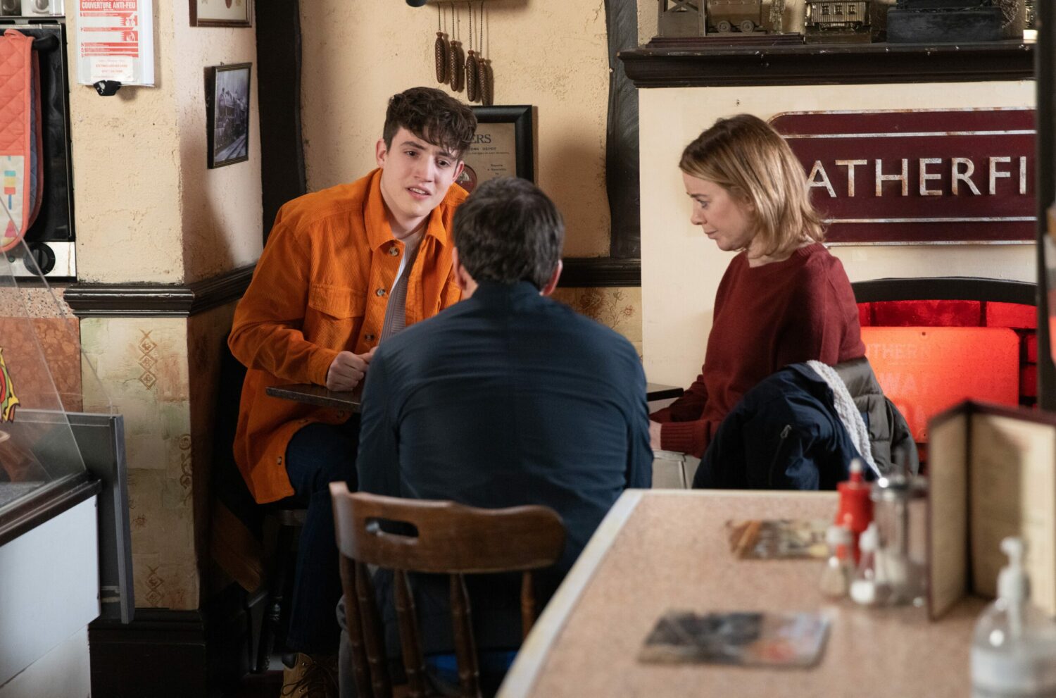 Coronation Street's Aaron, Abi and Eric are talking at Roy's