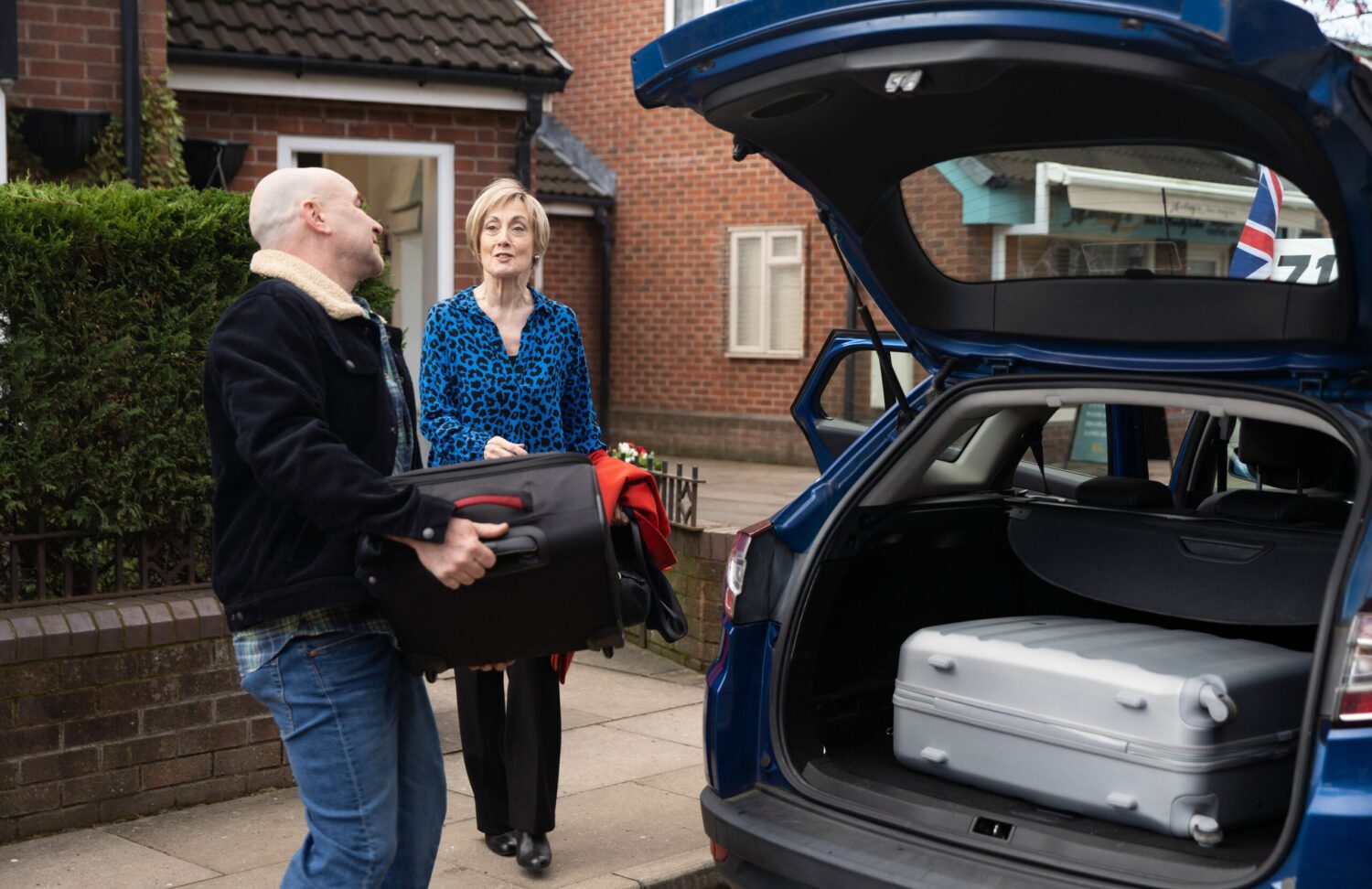 Tim loads Elaine's suitcase into the car in Coronation Street spoilers