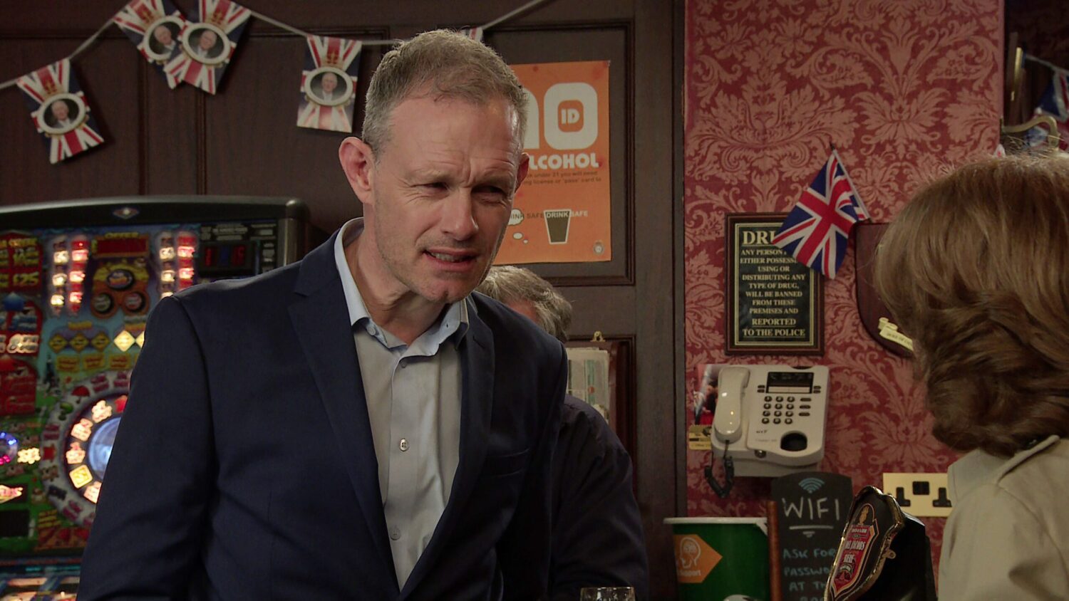 Nick Tilsley looks confused as he talks to Gail Rodwell in the Rovers