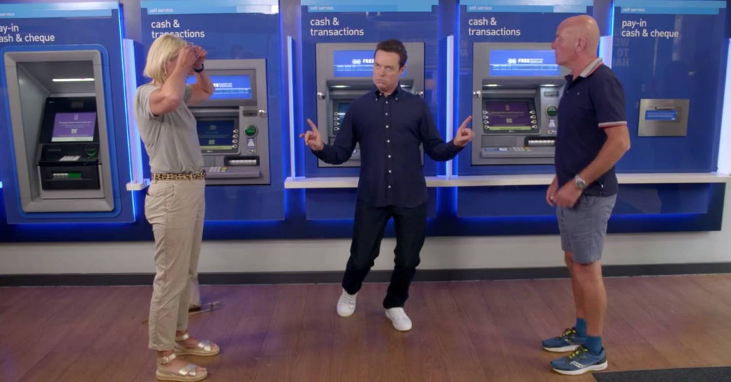 Stephen Mulhern plays a game with contestants on In For A Penny