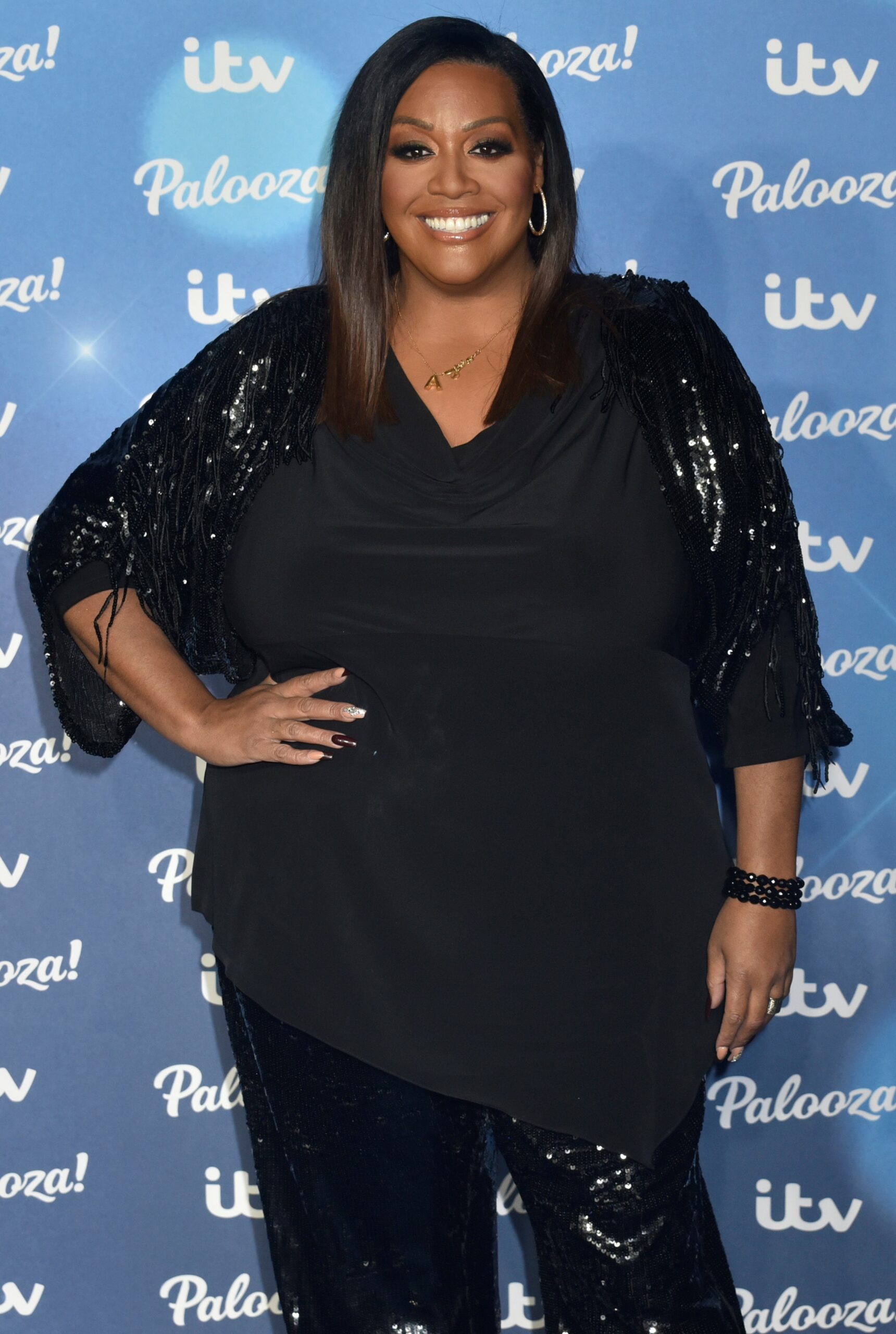 Alison Hammond smiling with hand on her hip at ITV Palooza